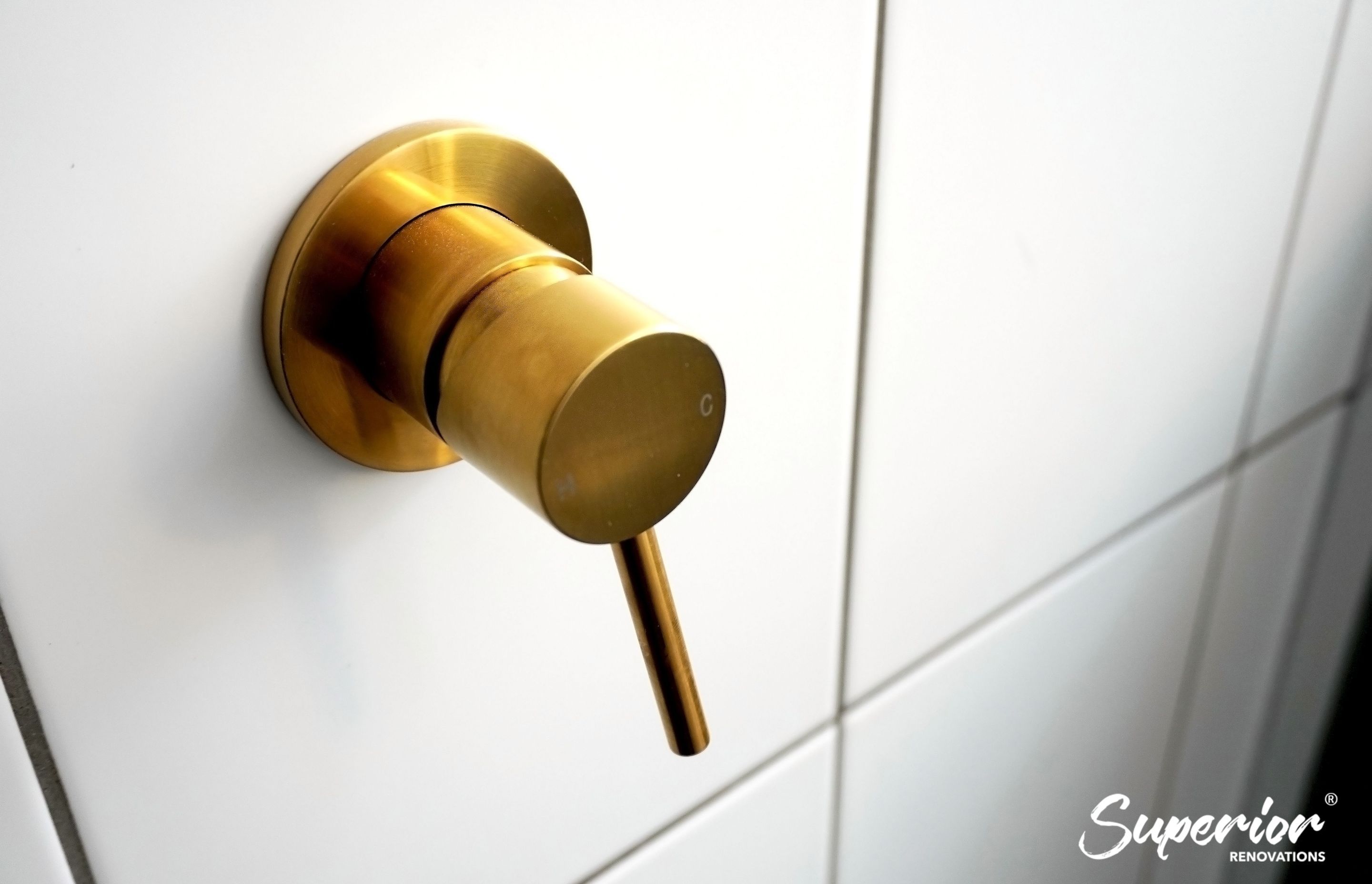 Gold fixtures used throughout the bathroom in Westmere