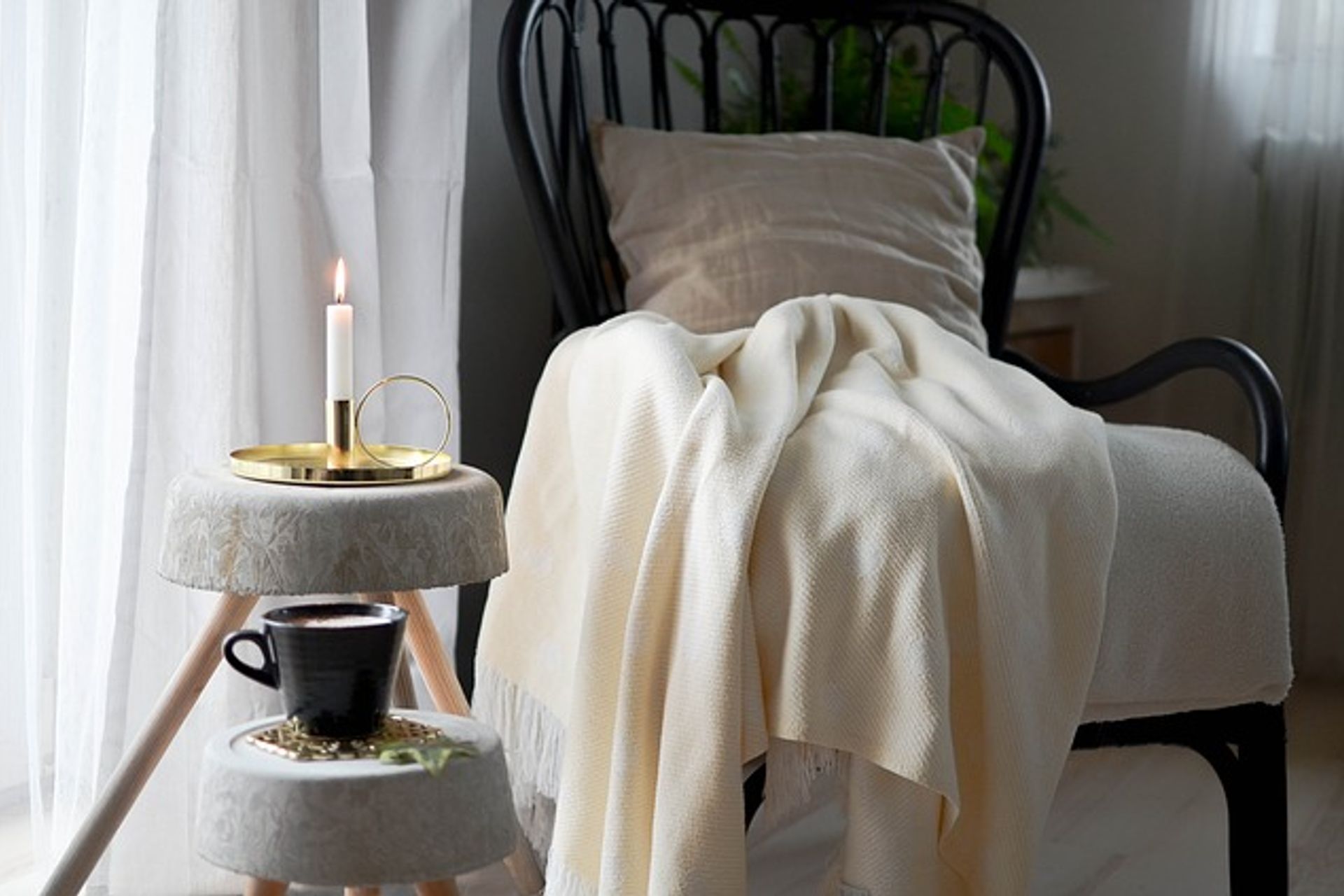 Occasional chair with cosy cushion and blanket