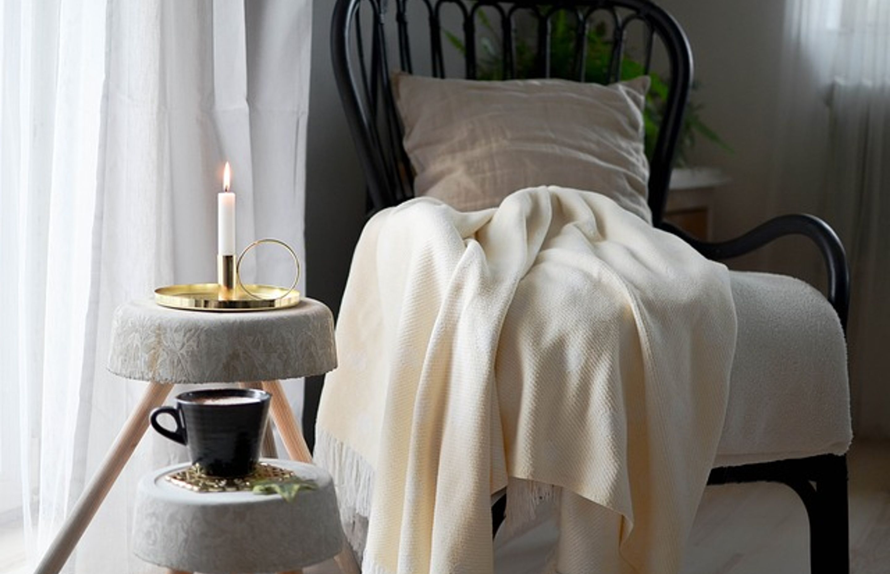 Occasional chair with cosy cushion and blanket