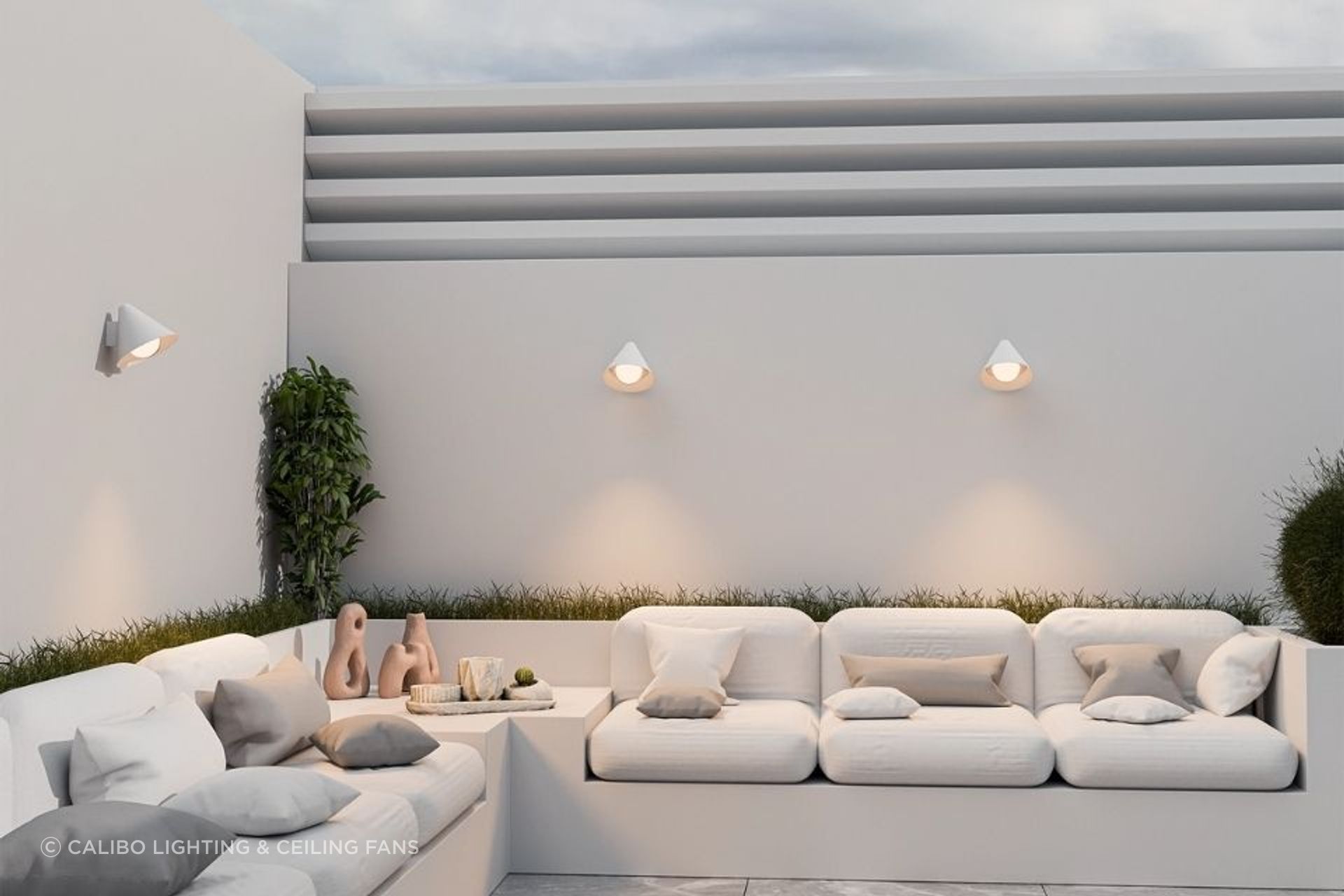 Coastal white, outdoor-ready. The Becard wall light makes the alfresco feel like a room.