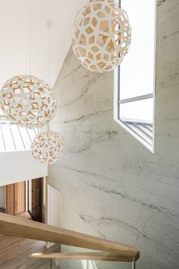 Roughcast concrete wall panels by Muros showcase the subtle rawness of concrete.