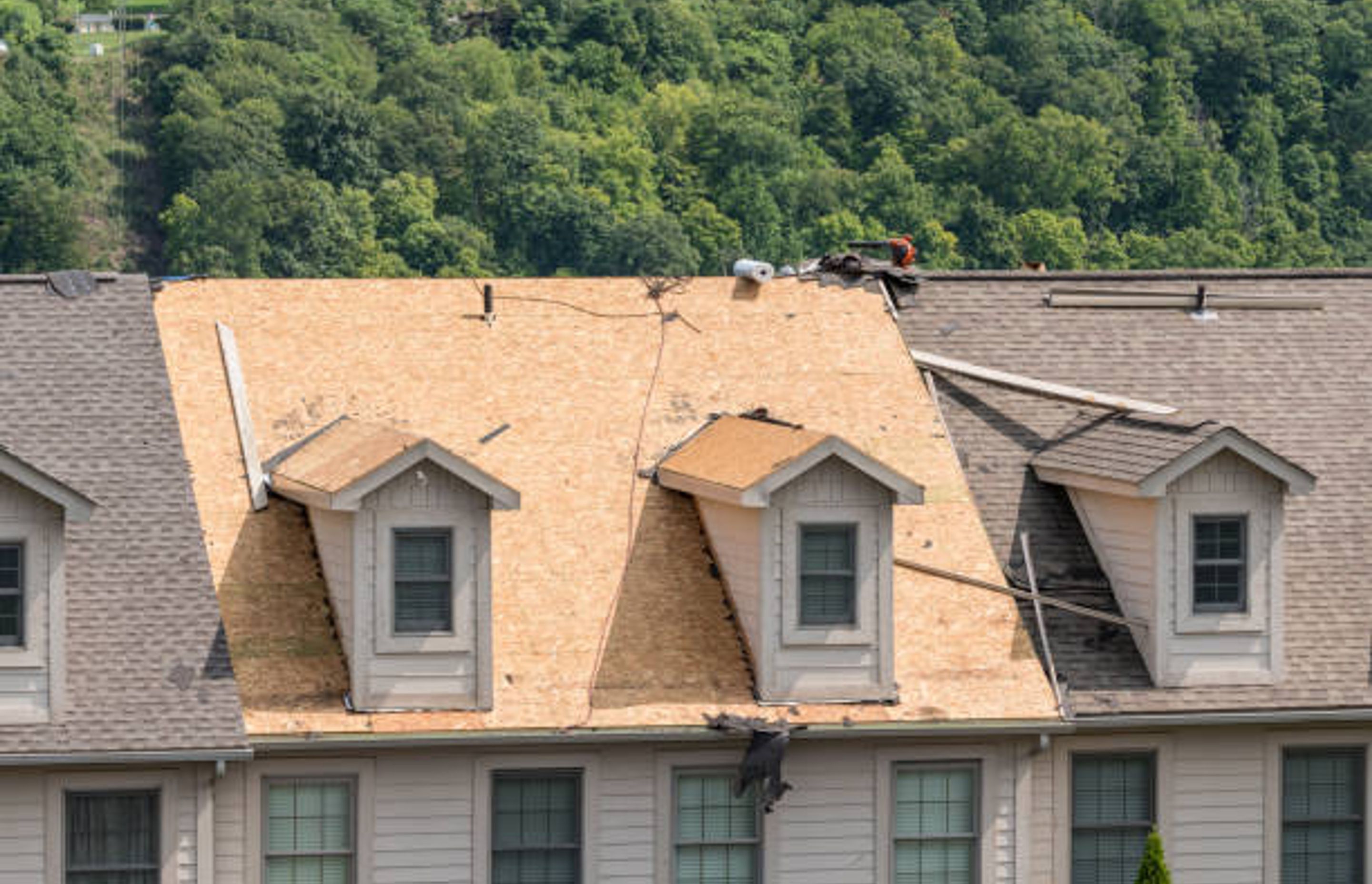 Reroofing a house | Photo Credit - iStock