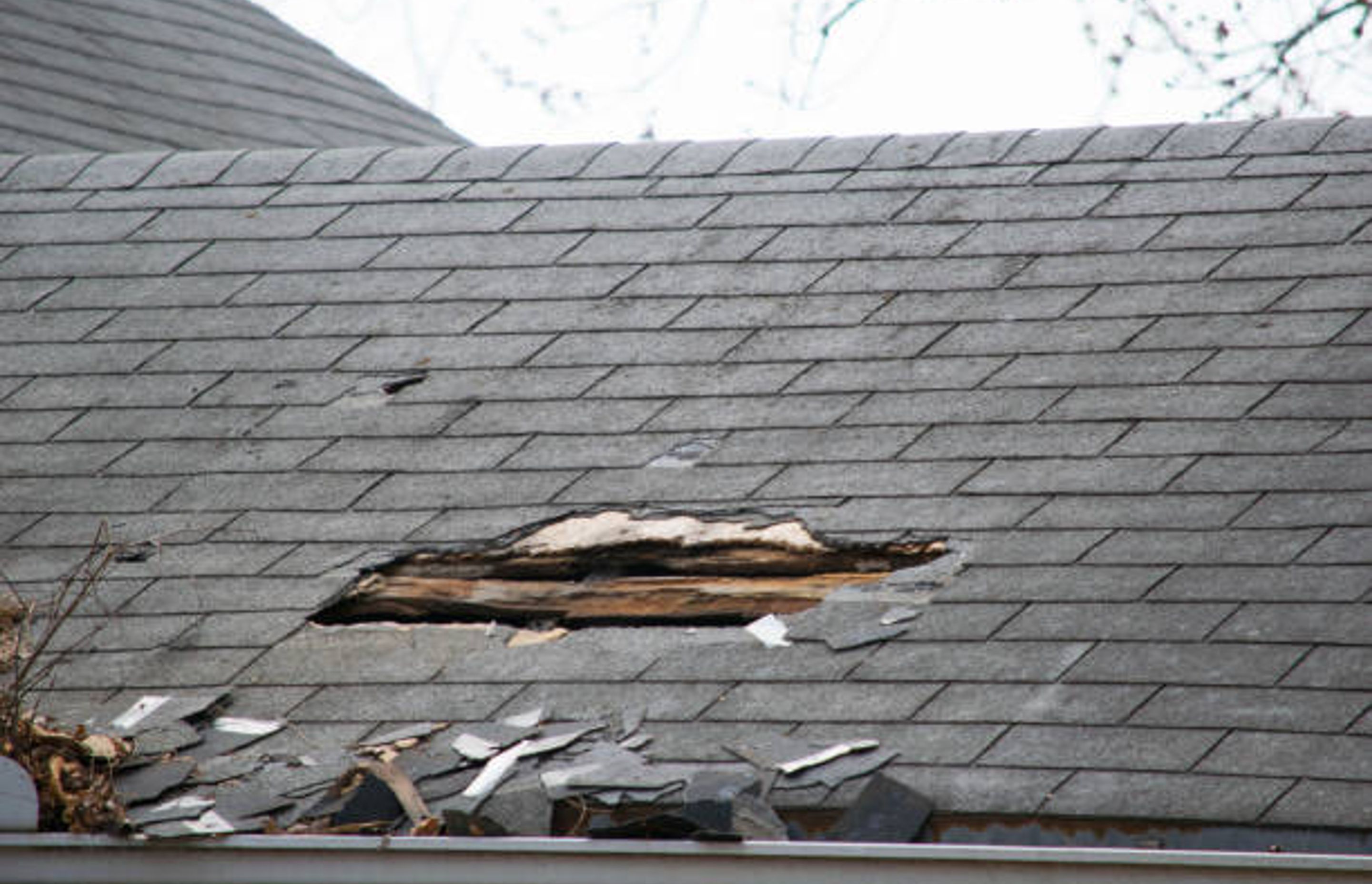 Broken Roof. Most likely need a roof replacement | Photo Credit – iStock