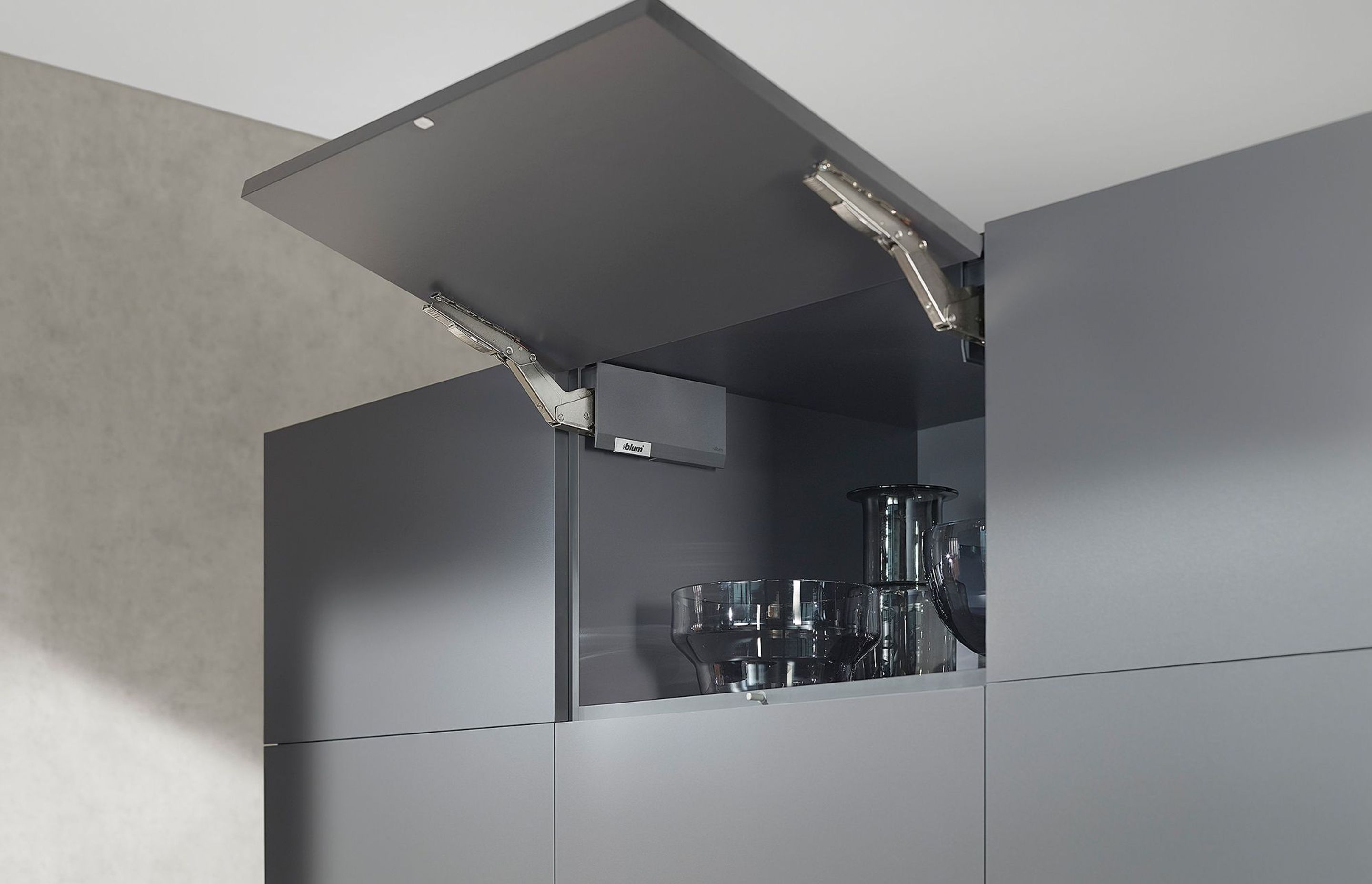 Give cabinet designs a lift with the AVENTOS HK top opening system