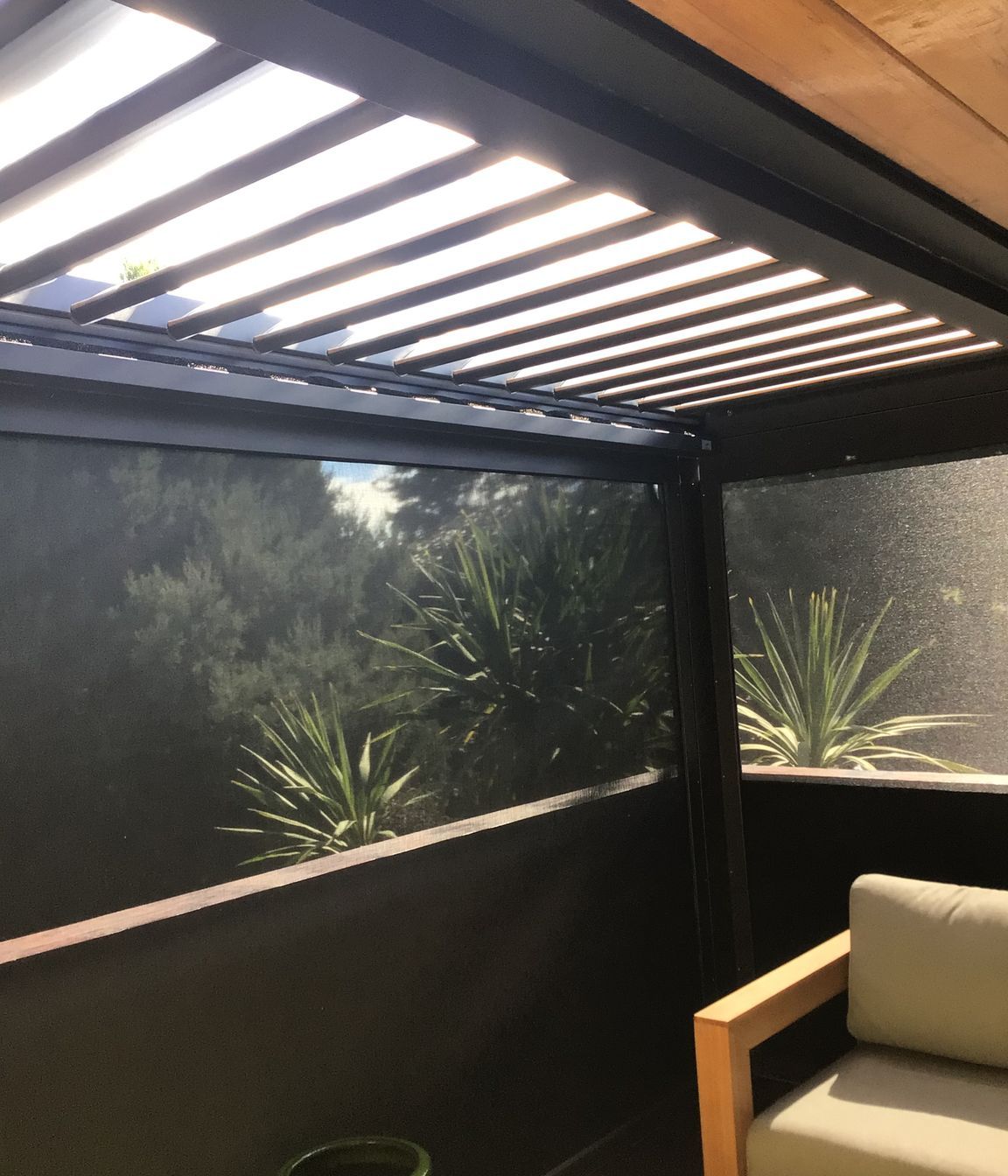 Enclose a balcony – here shown with a louvre roof and Securo outdoor blinds in Techno X fabric.