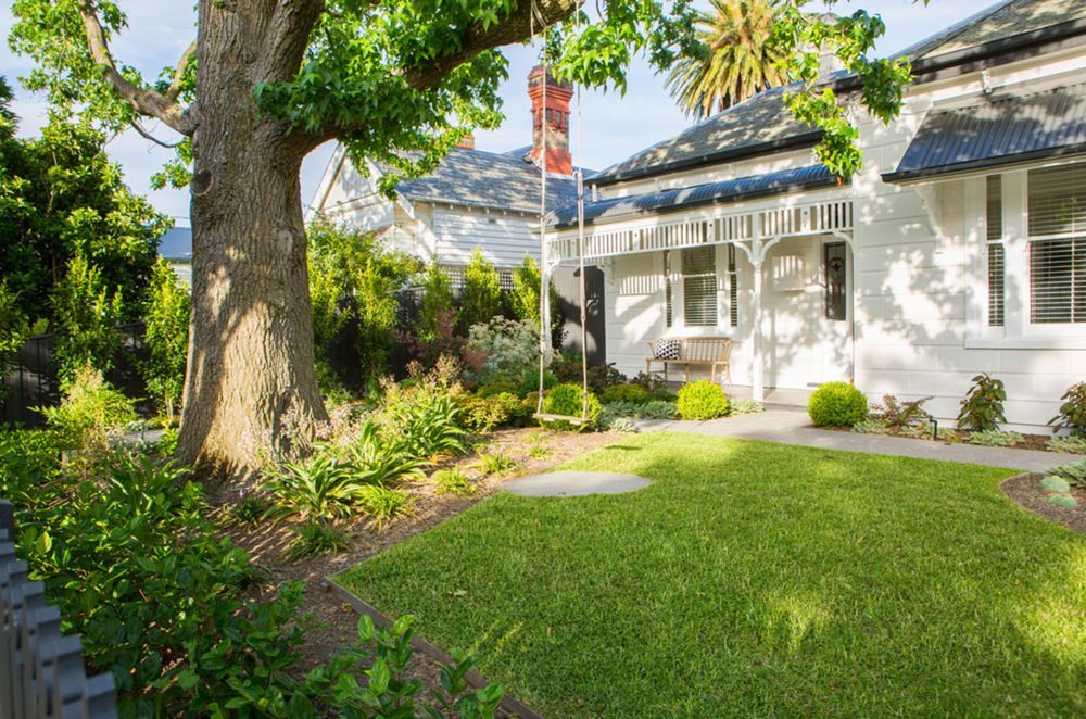 A simple swing adds a nice touch to this front garden