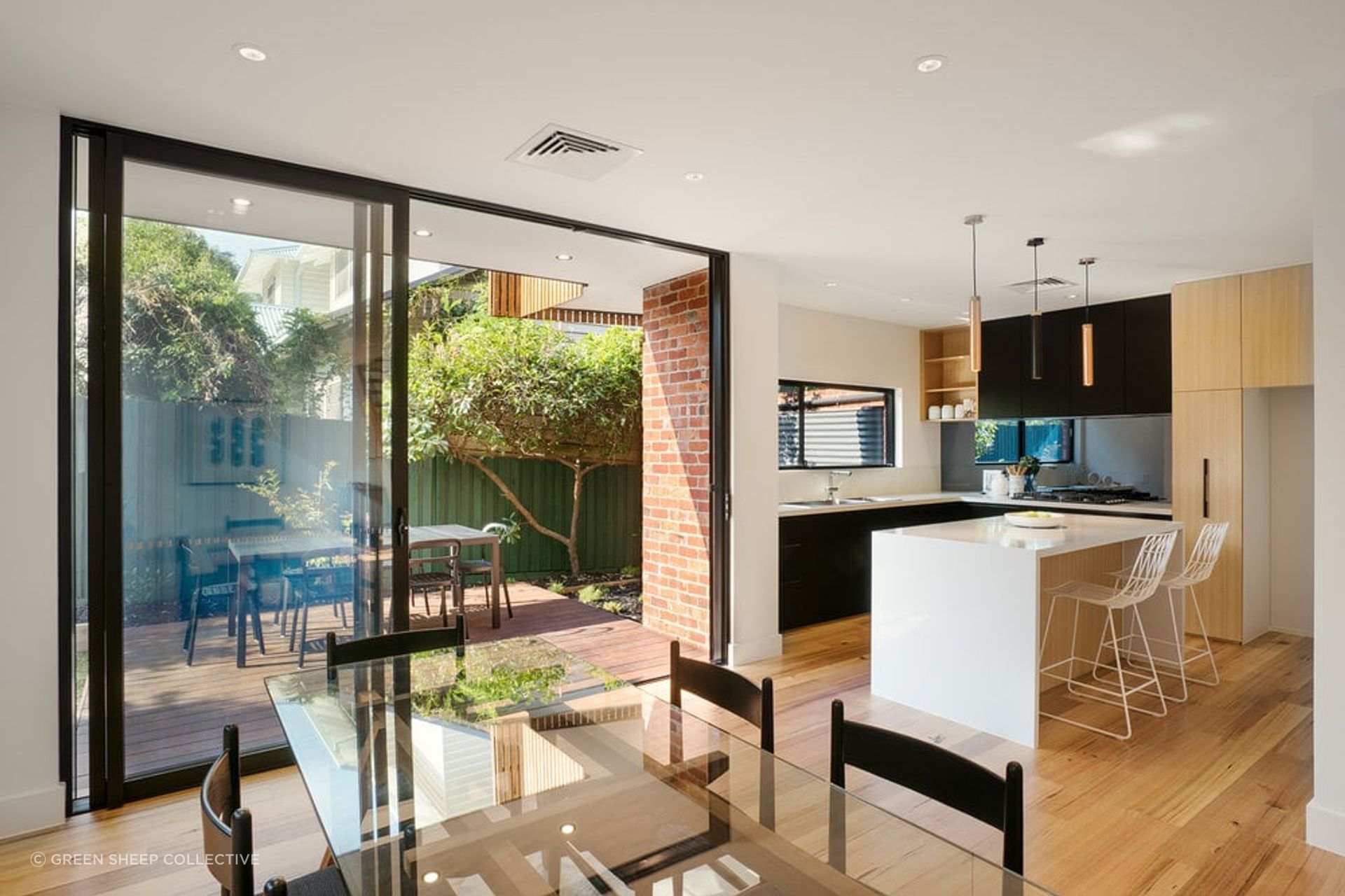 The kitchen flows effortlessly into the dining space. Photography by Emma Cross.