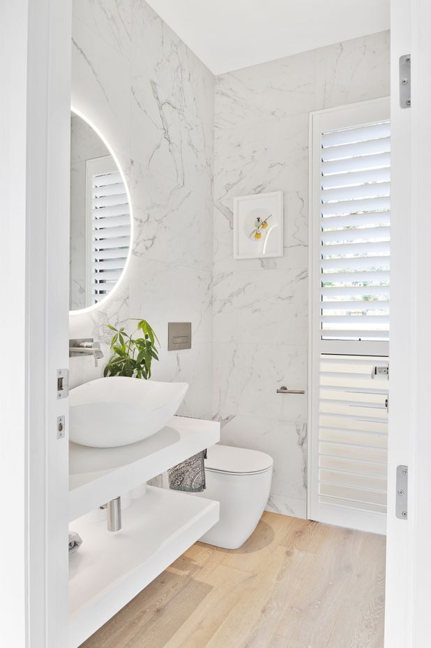 White finishes were installed in the bathroom for a clean, bright feel.