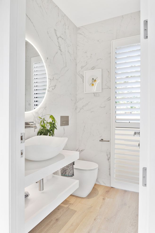 White finishes were installed in the bathroom for a clean, bright feel.