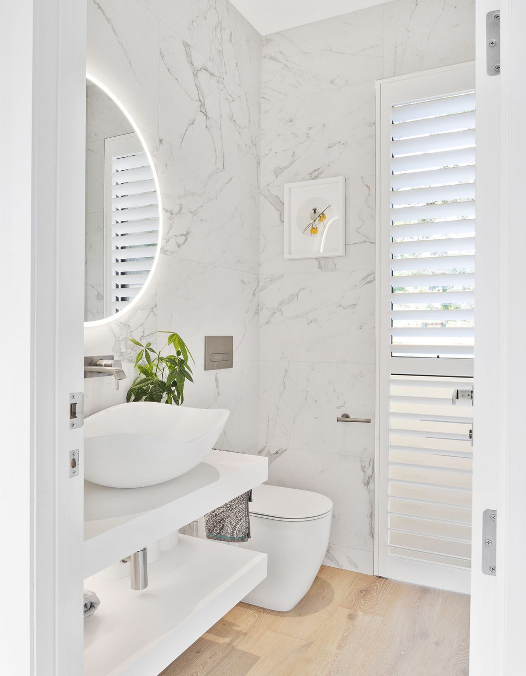 White finishes were installed in the bathroom for a clean, bright feel.