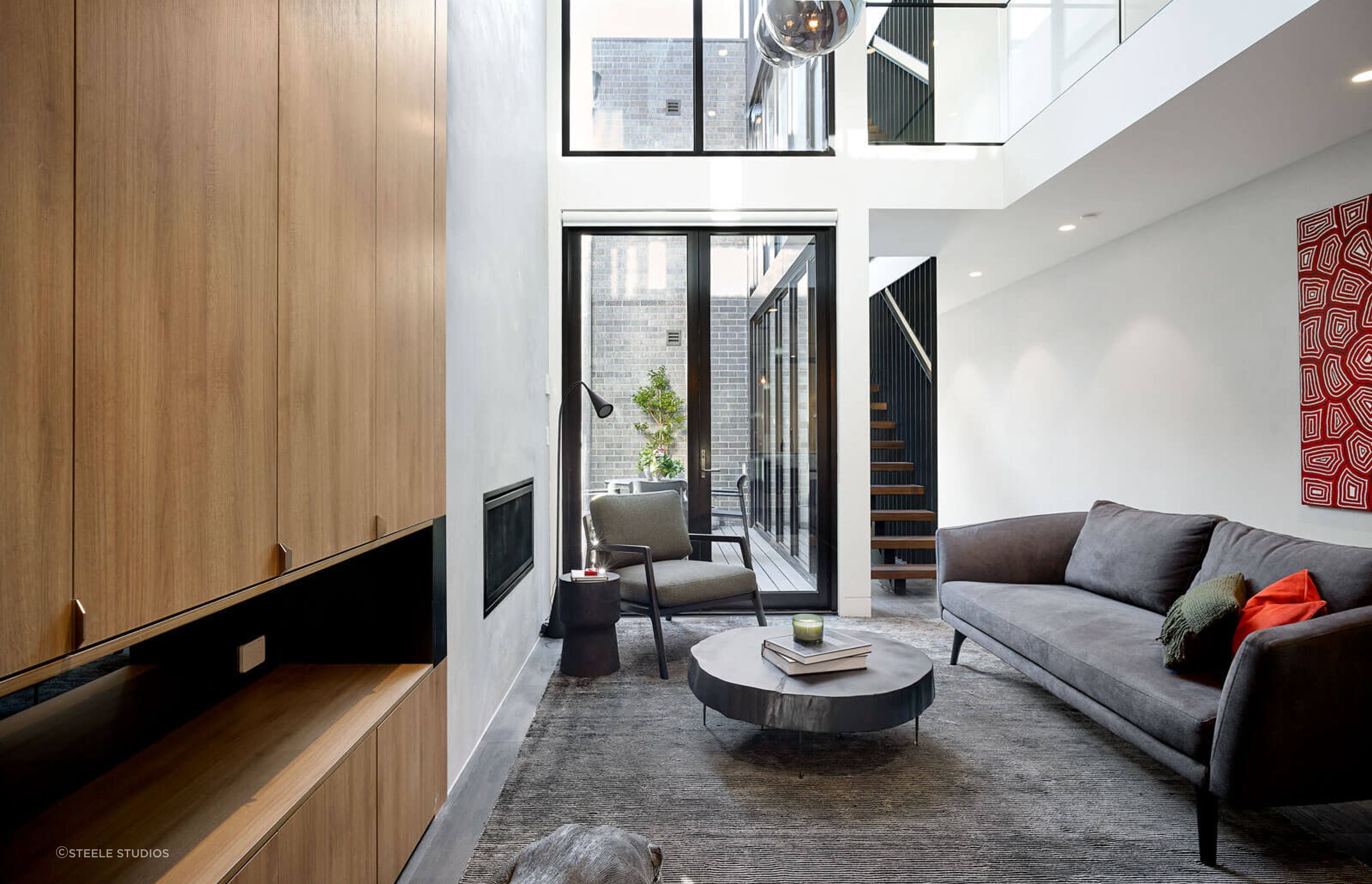 Distressed materials, textures and textiles instil the industrial theme in this Cremorne home