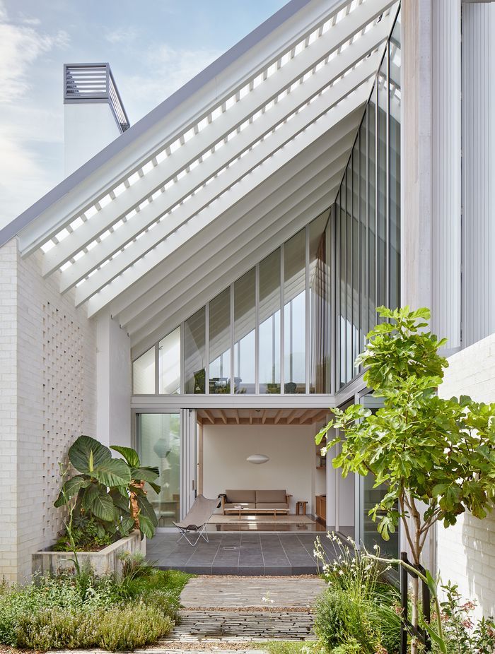 Point House by Guy Tarrant Architects with furniture from Good Form – N-CT01 Coffee Table and N-S01 Sofa by Karimoku Case