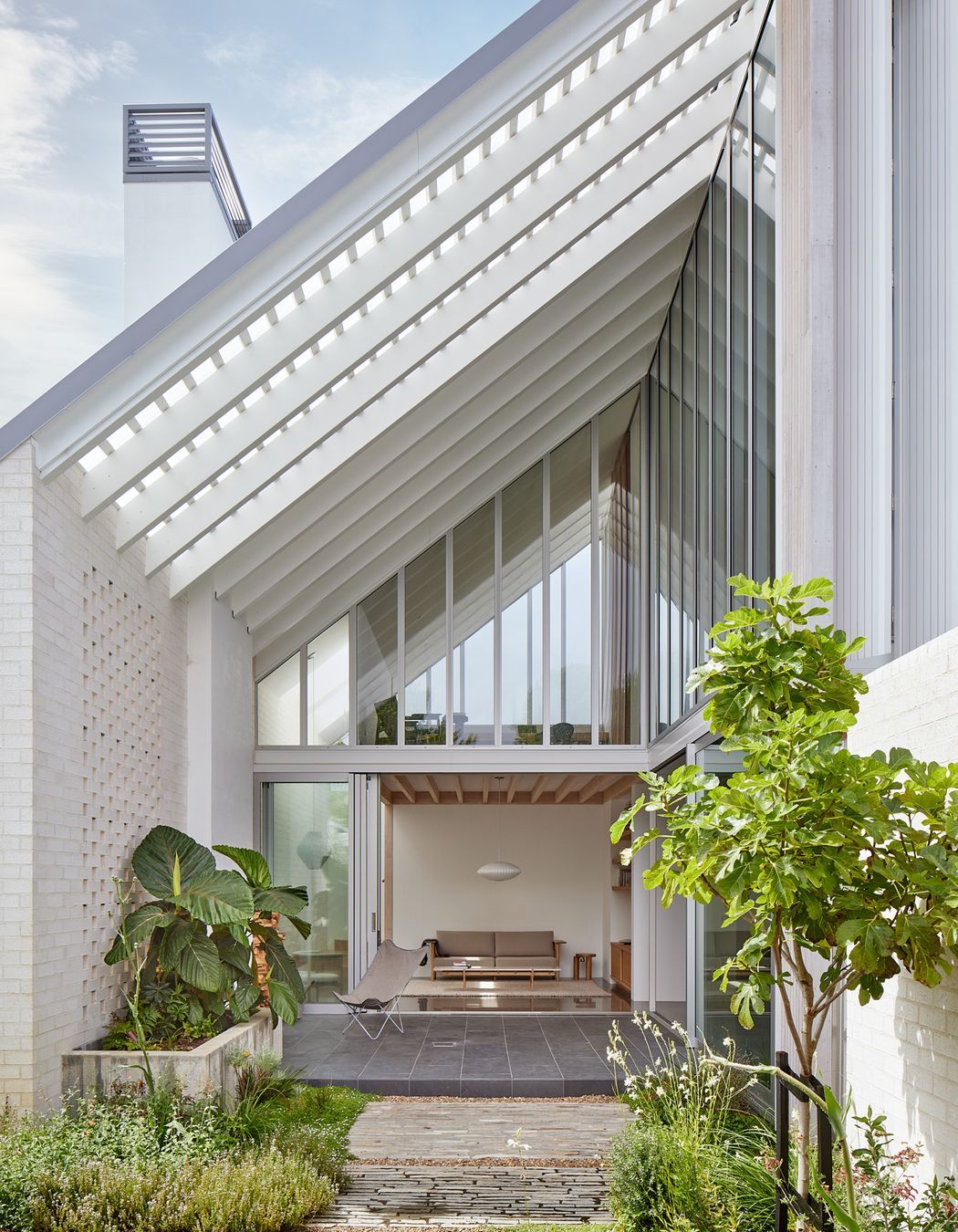 Point House by Guy Tarrant Architects with furniture from Good Form – N-CT01 Coffee Table and N-S01 Sofa by Karimoku Case