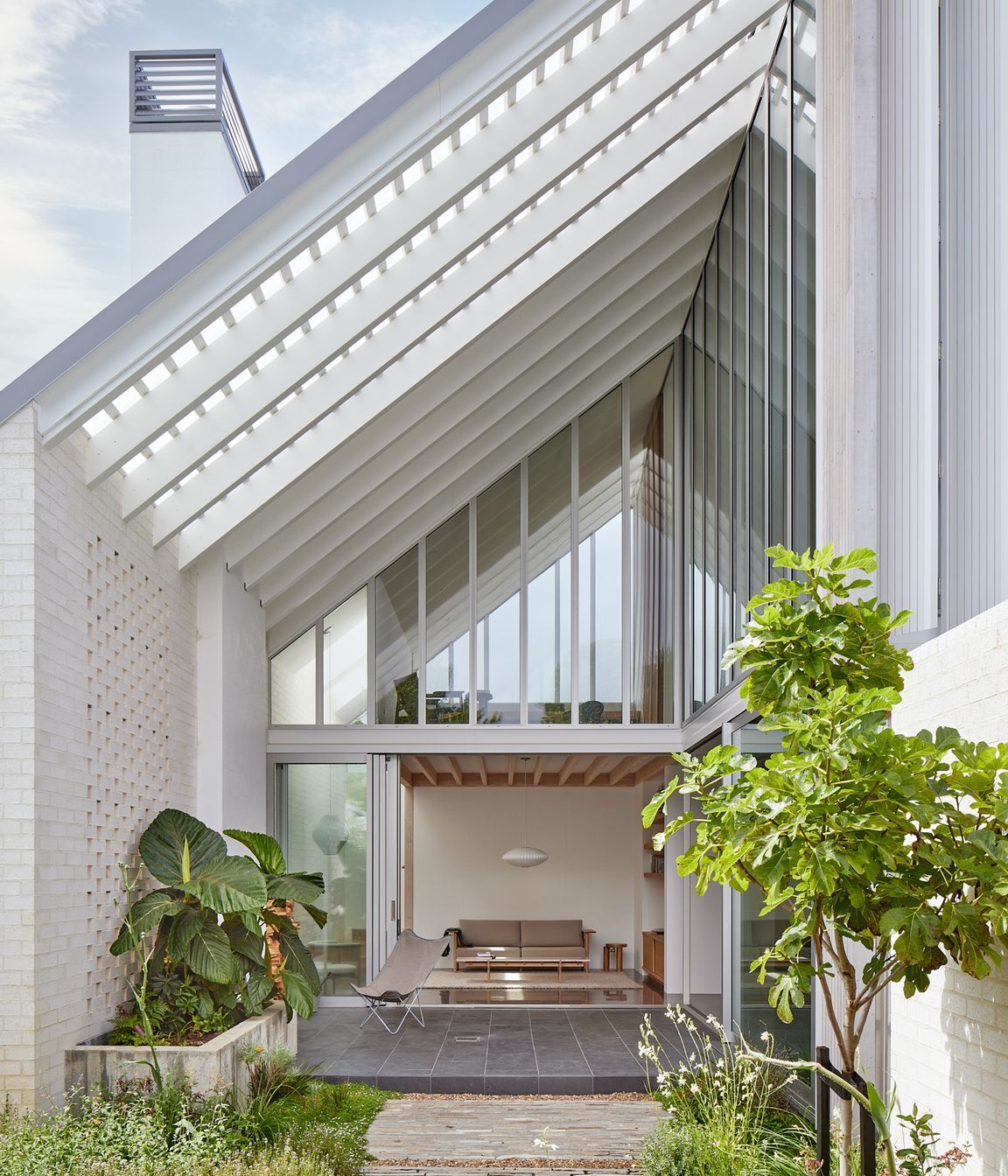 Point House by Guy Tarrant Architects with furniture from Good Form – N-CT01 Coffee Table and N-S01 Sofa by Karimoku Case