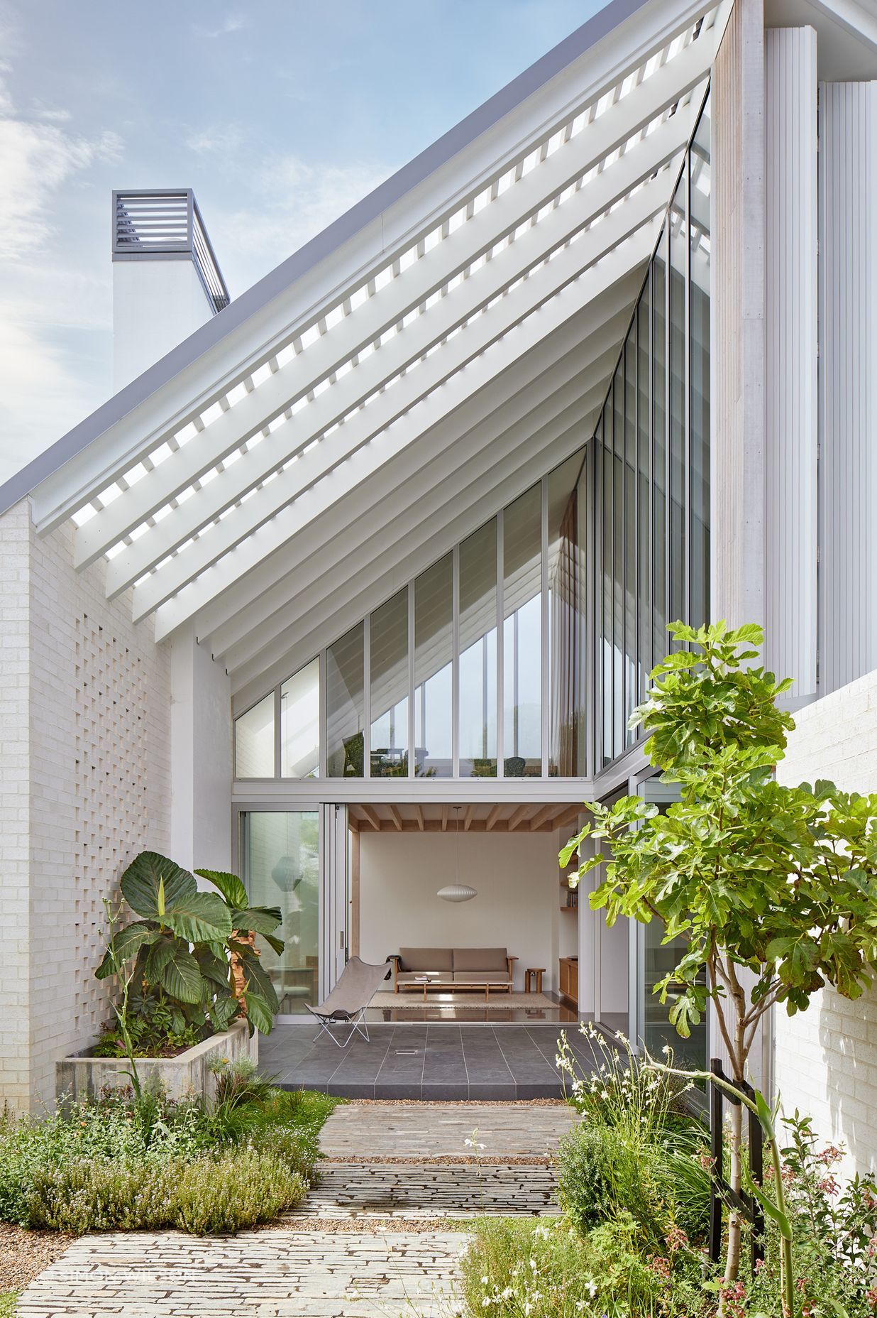 Point House by Guy Tarrant Architects with furniture from Good Form – N-CT01 Coffee Table and N-S01 Sofa by Karimoku Case