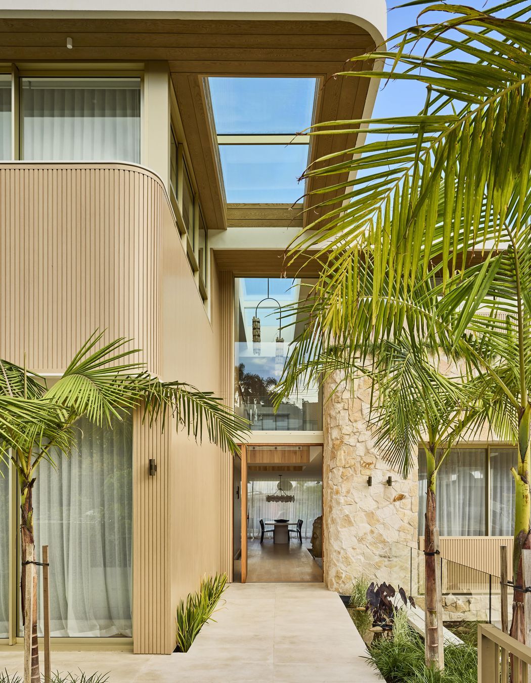 Wanderlust in Vaucluse by Conway & Wise. A coastal sanctuary inspired by Morocco, Santorini, and Los Angeles, featuring Crema Vialle Limestone flowing through the entry, balconies, and outdoor spaces. One of 2025's standout residential projects.