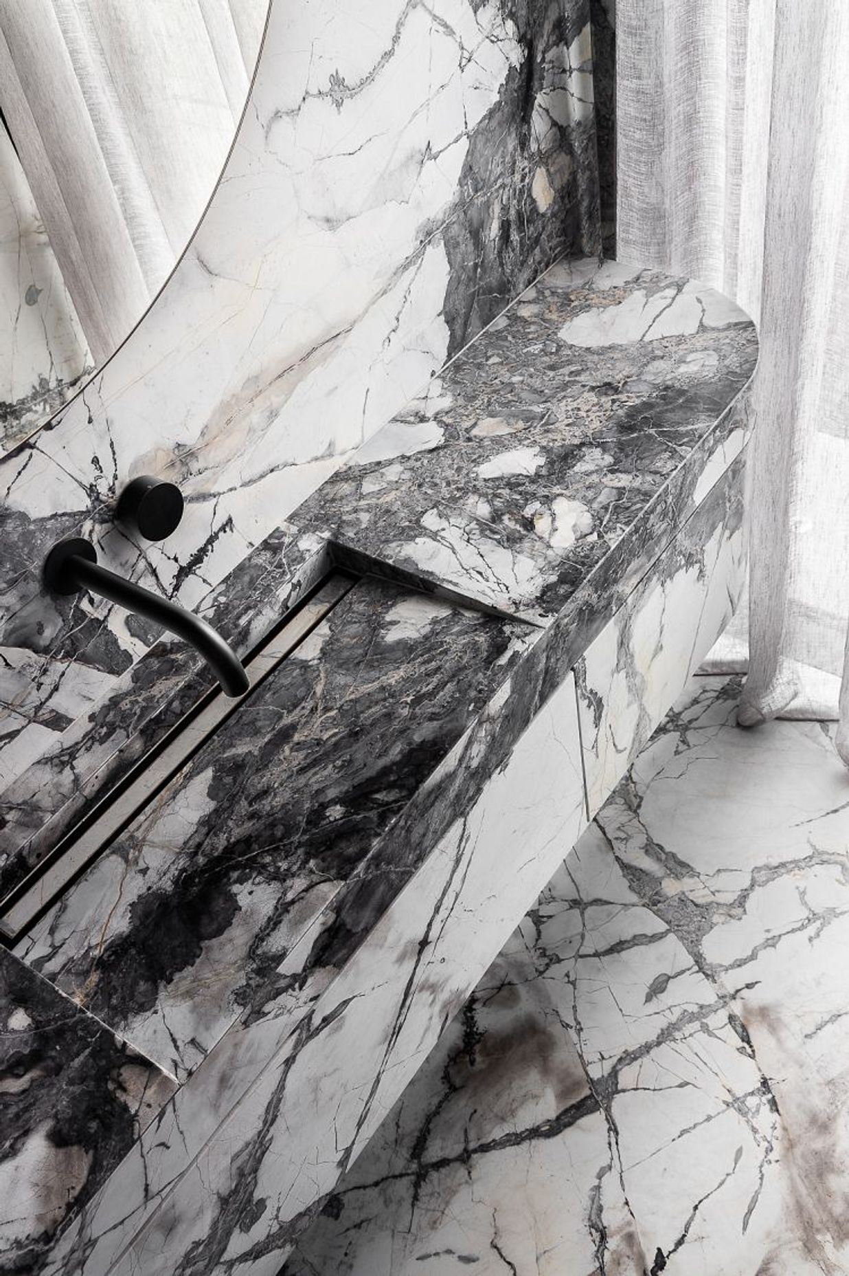 Concordia Honed to bathroom floor, wall and vanity. Scalpellino House by Biasol. Photography by Timothy Kaye 
