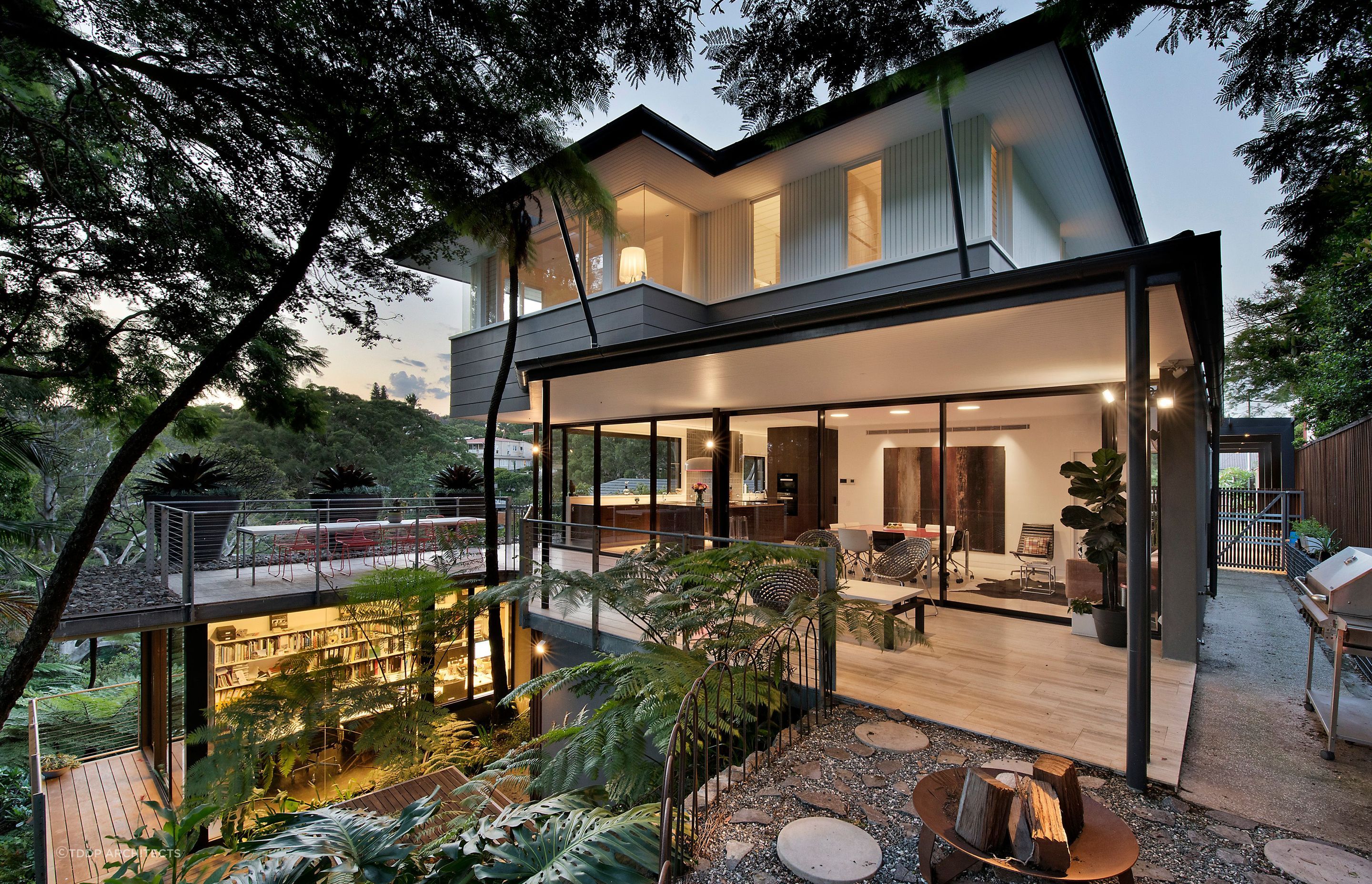 The house is designed to harmonise with the surrounding rainforest vegetation. Photography: Adam Resch