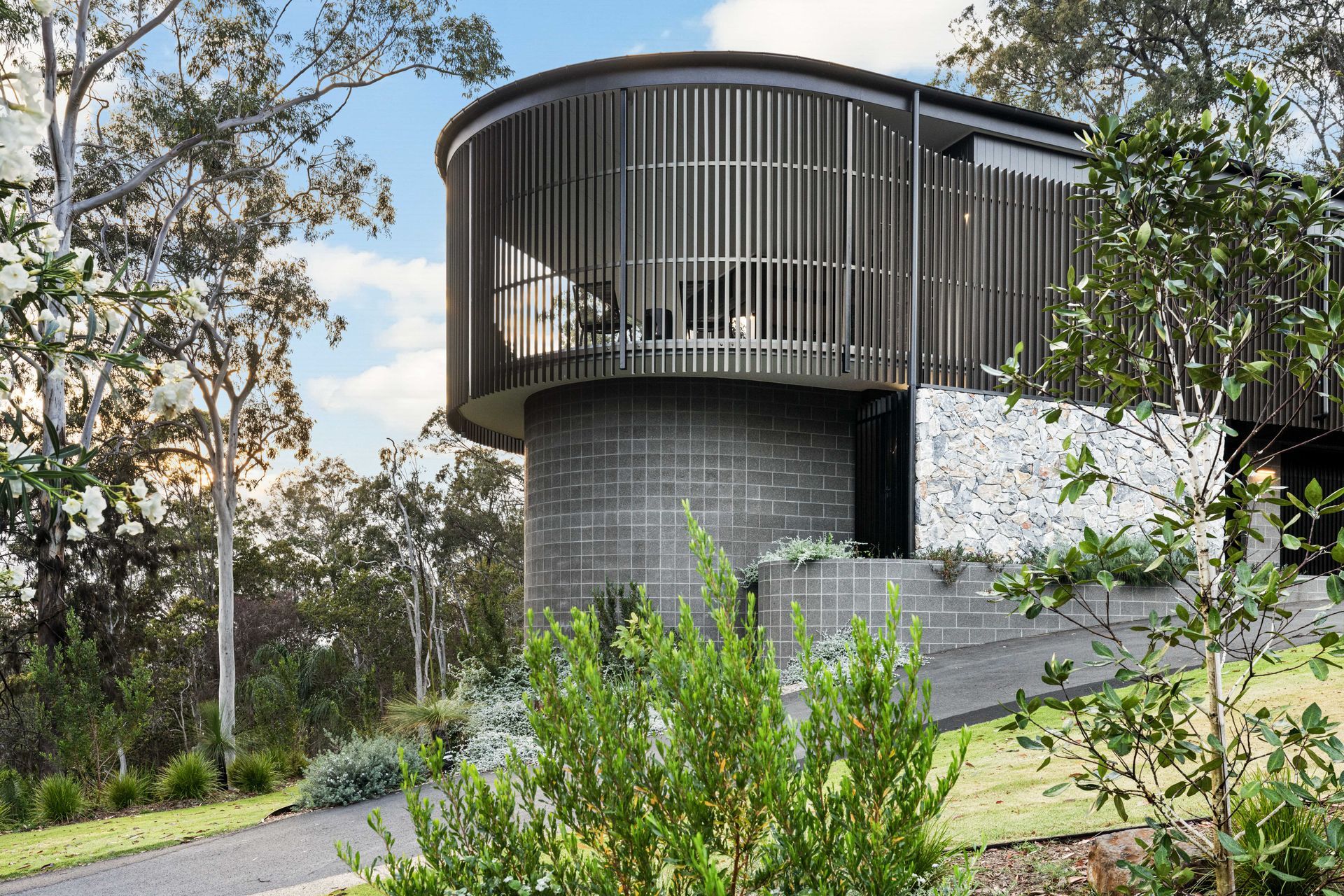 There are plenty of stunning facades that integrate different materials, such as natural stone cladding and forms of metal cladding.