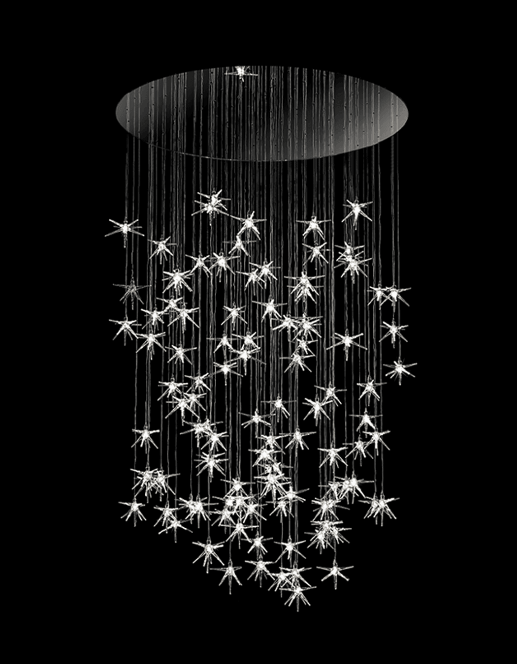 Stella Chandelier with pendant stars in blown borosilicate glass. Composition, quantity and length are customisable