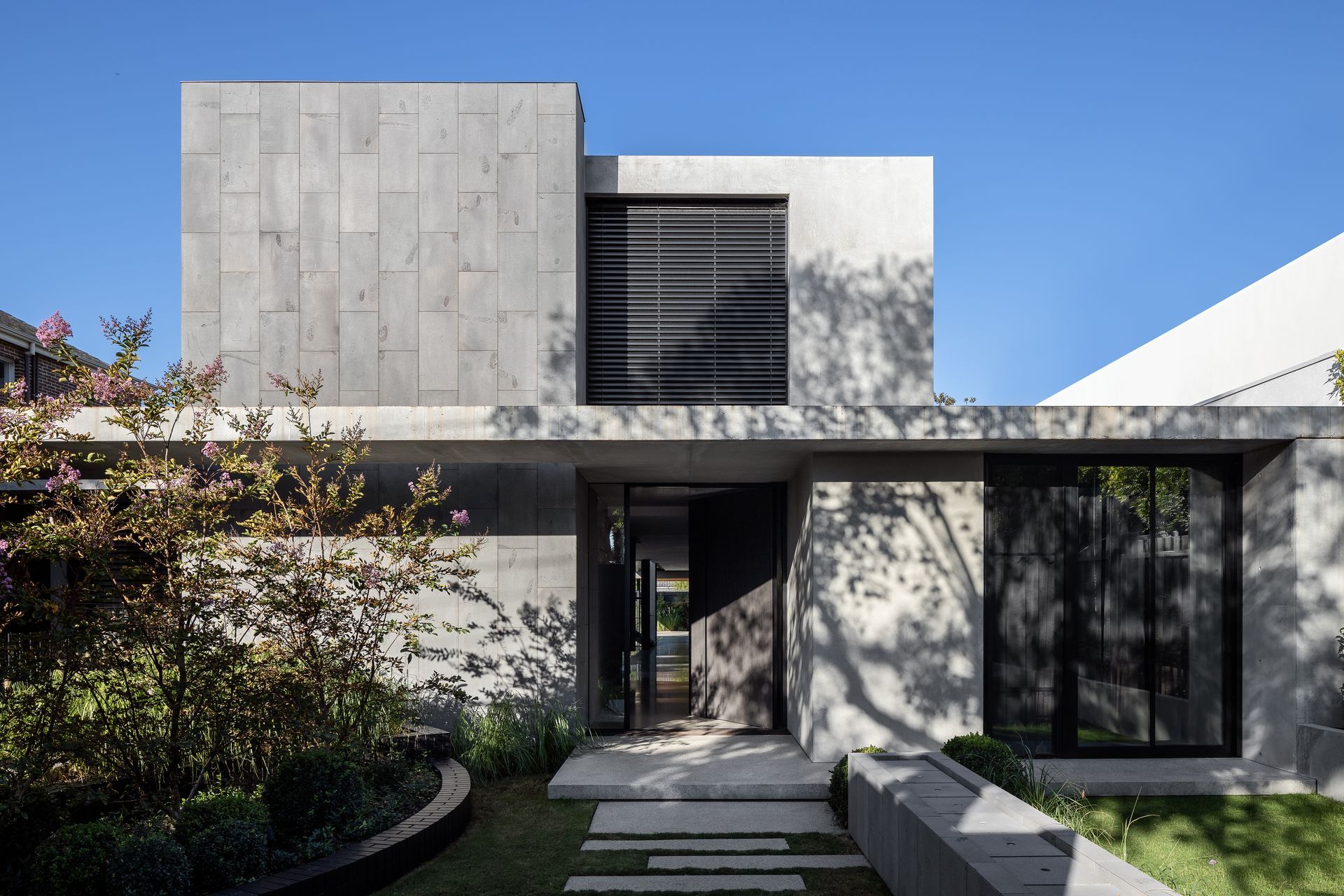 The moody entrance to the Sussex Residence is distinct, and stands out to passers-by. Photography: Timothy Kaye