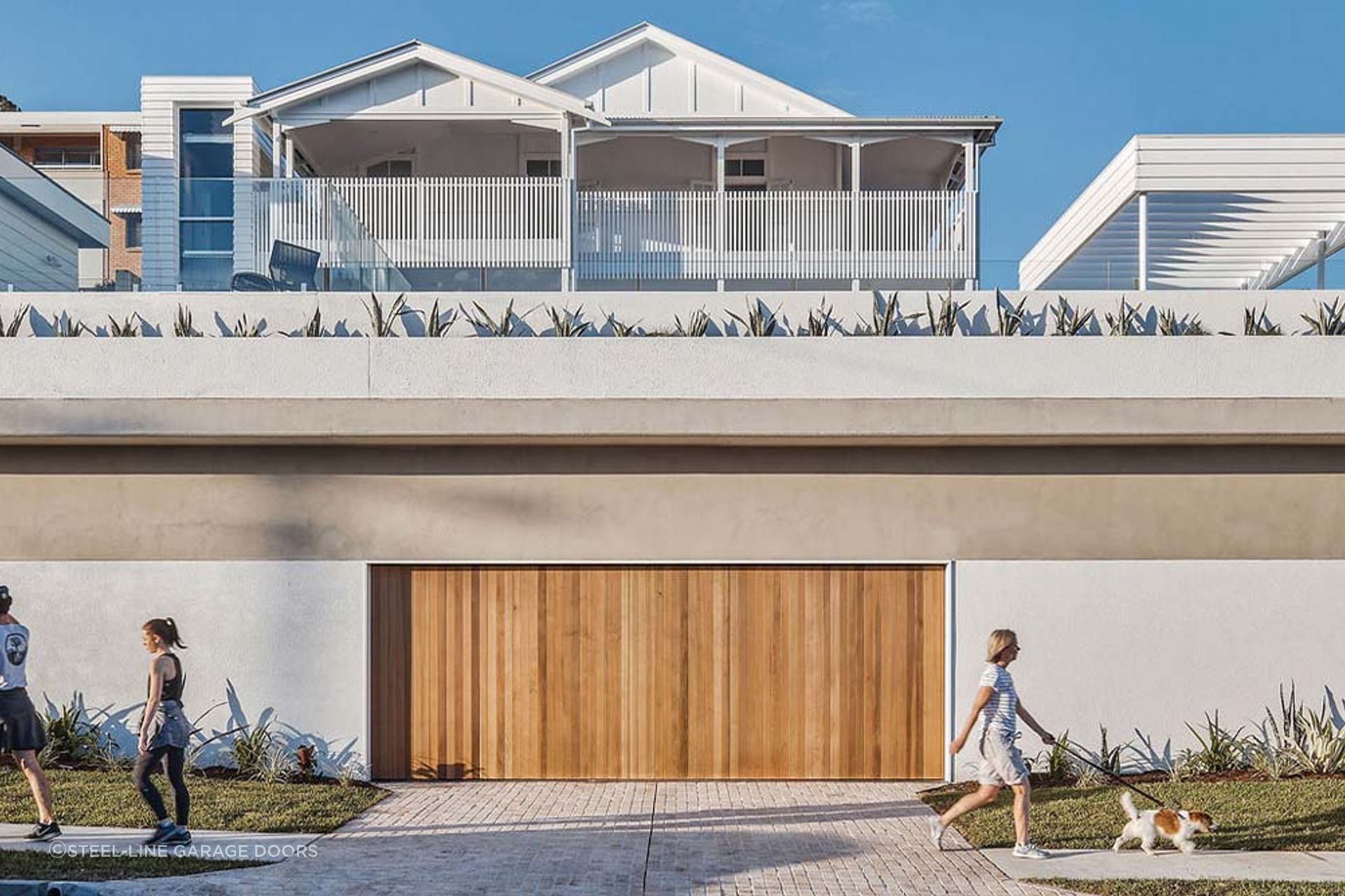 Using neutral colours for your exterior walls can complement a timber garage door effortlessly.