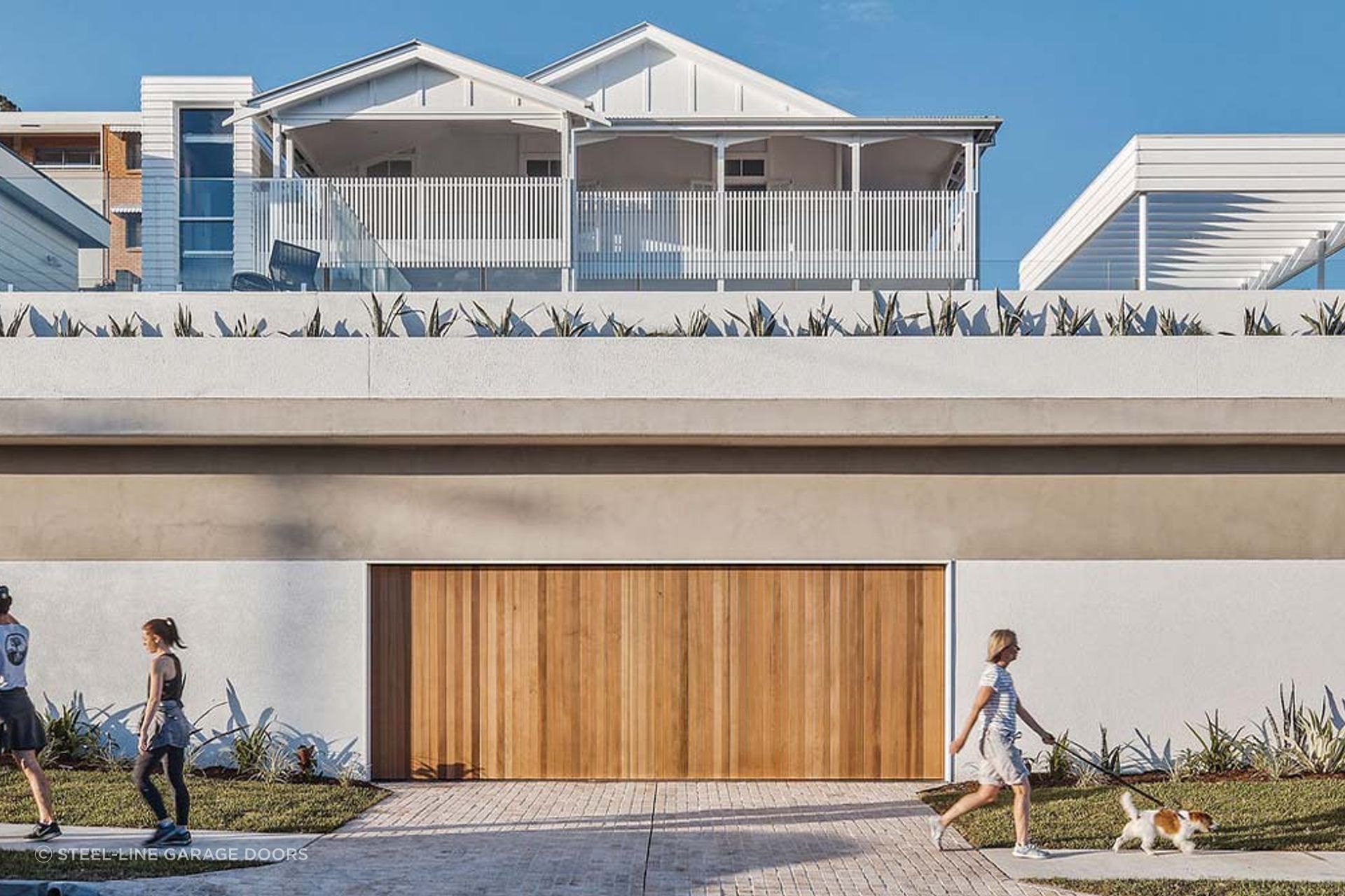 Using neutral colours for your exterior walls can complement a timber garage door effortlessly.