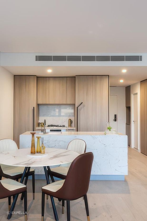 Expella tested and reported on range-hood performance prior to construction and installed Miele under-mount rangehoods in all of the kitchens at Natura. The under-mount range hood is concealed behind the kitchen joinery above the cook top.