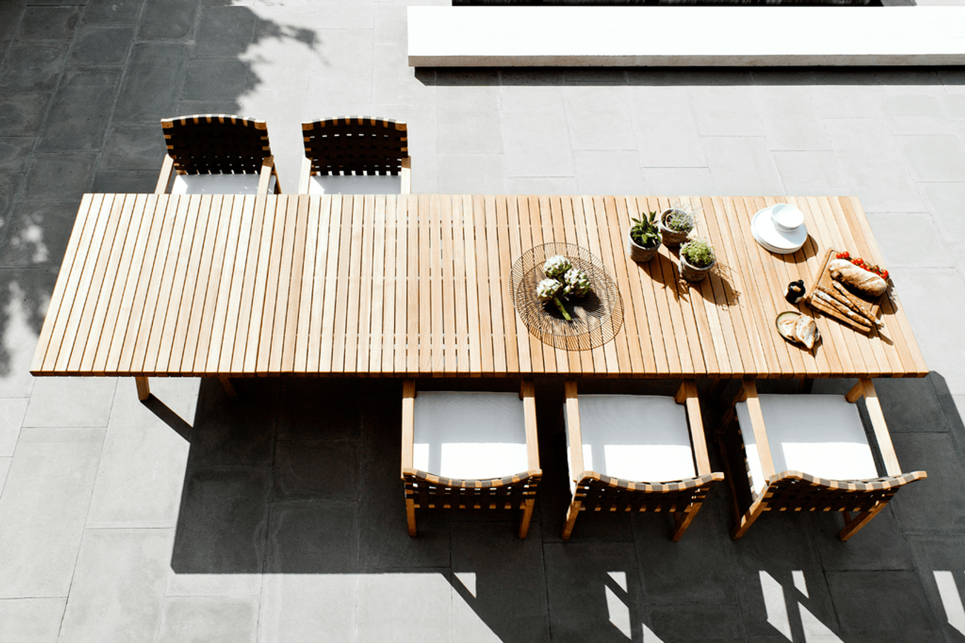 Pictured: Vis a Vis Dining Table by Tribu.