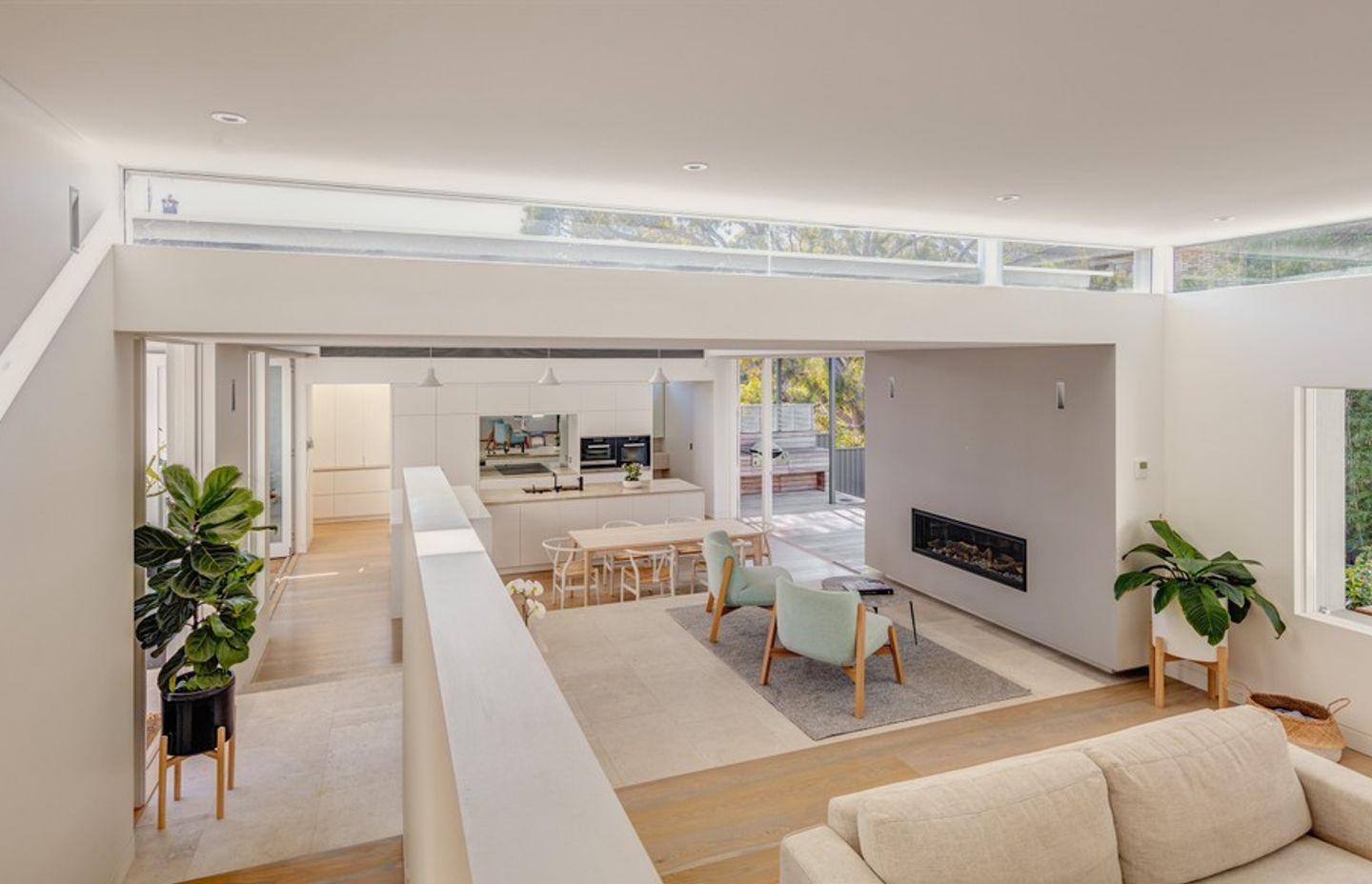 Subtle level changes and variations in light work to define the zones of living while maintaining an open plan layout.