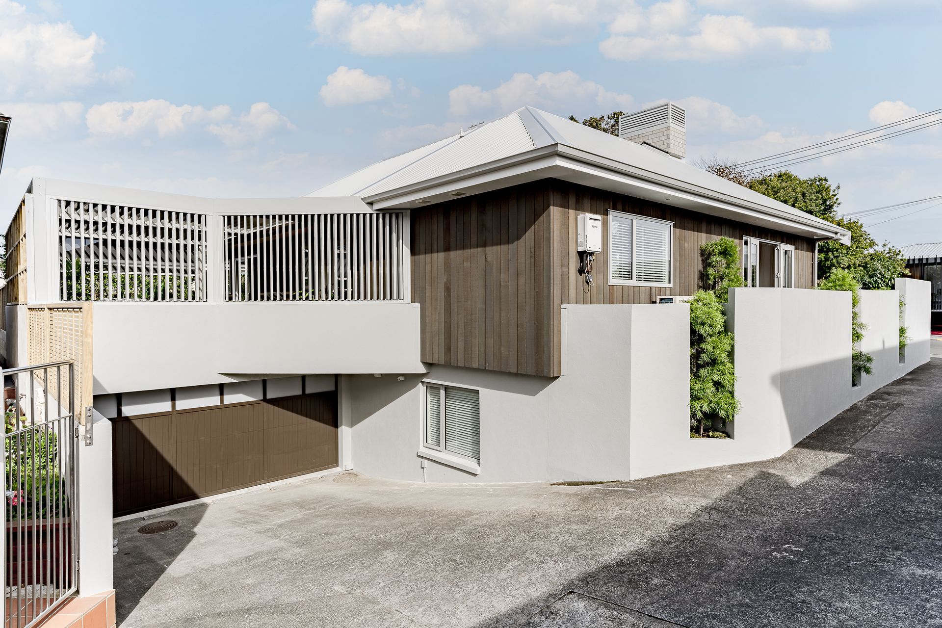 From the street the home appears single storey, but following the curve of the driveway you discover the ground floor below.