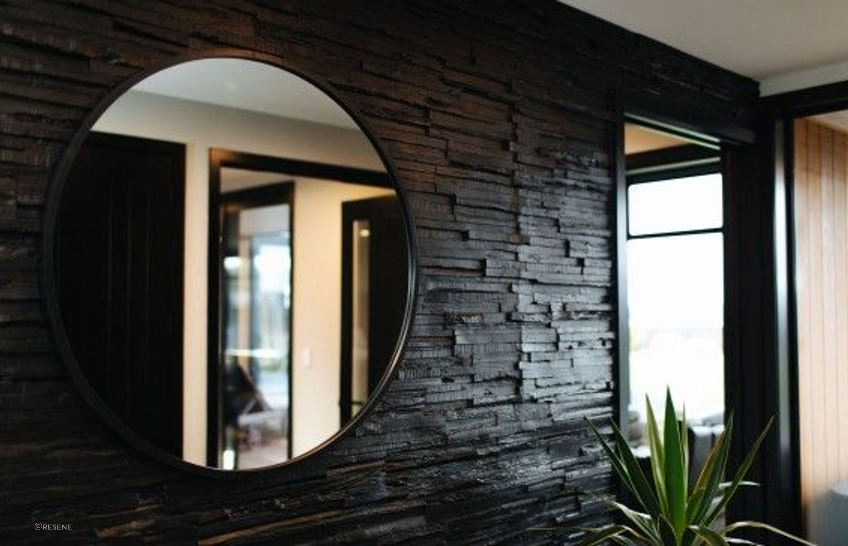 This Oamaru residential home by Design Federation features a Muros wall product painted in Resene Nero. Ceiling in Resene Double Alabaster. Image by Rachel Wybrow Photography.