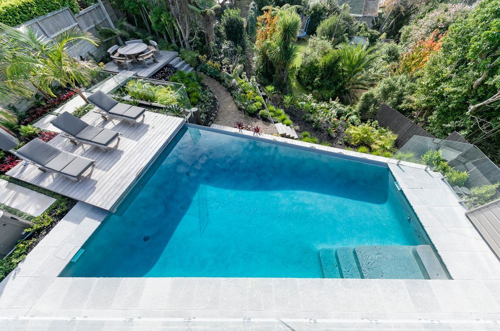 The swimming pool, constructed by Auckland Inground Pools, was the centrepiece of the landscaping project.