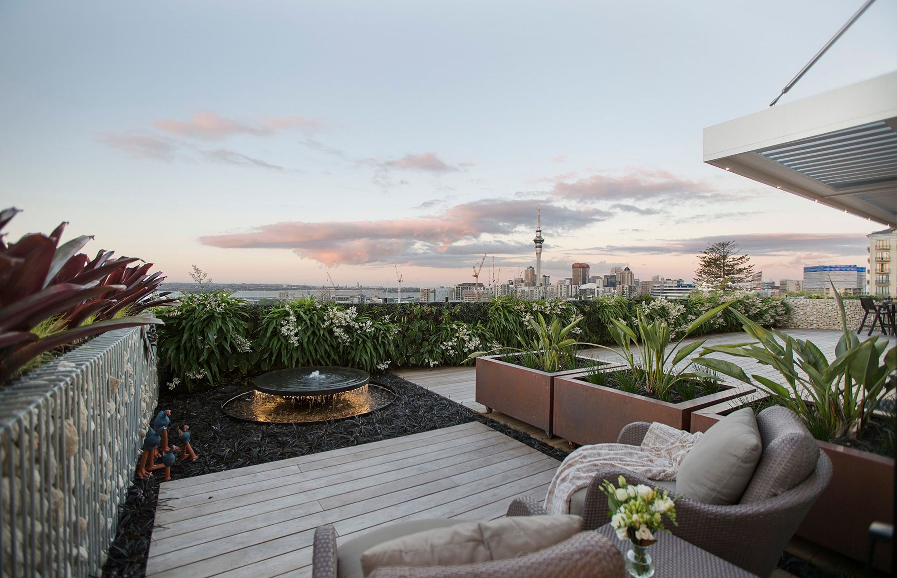 Natural Habitats designed and built a revolutionary rooftop landscape for this private Auckland apartment, which features city and harbour views and a beautiful green entertaining space that comfortably hosts up to 30 guests.