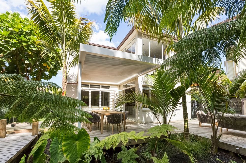 A fernery surrounded by a timber walkway is a great way to break up a back yard into a distinctive outdoor room, as well as being low maintenance and creating the effect of being situated within a lush forest.