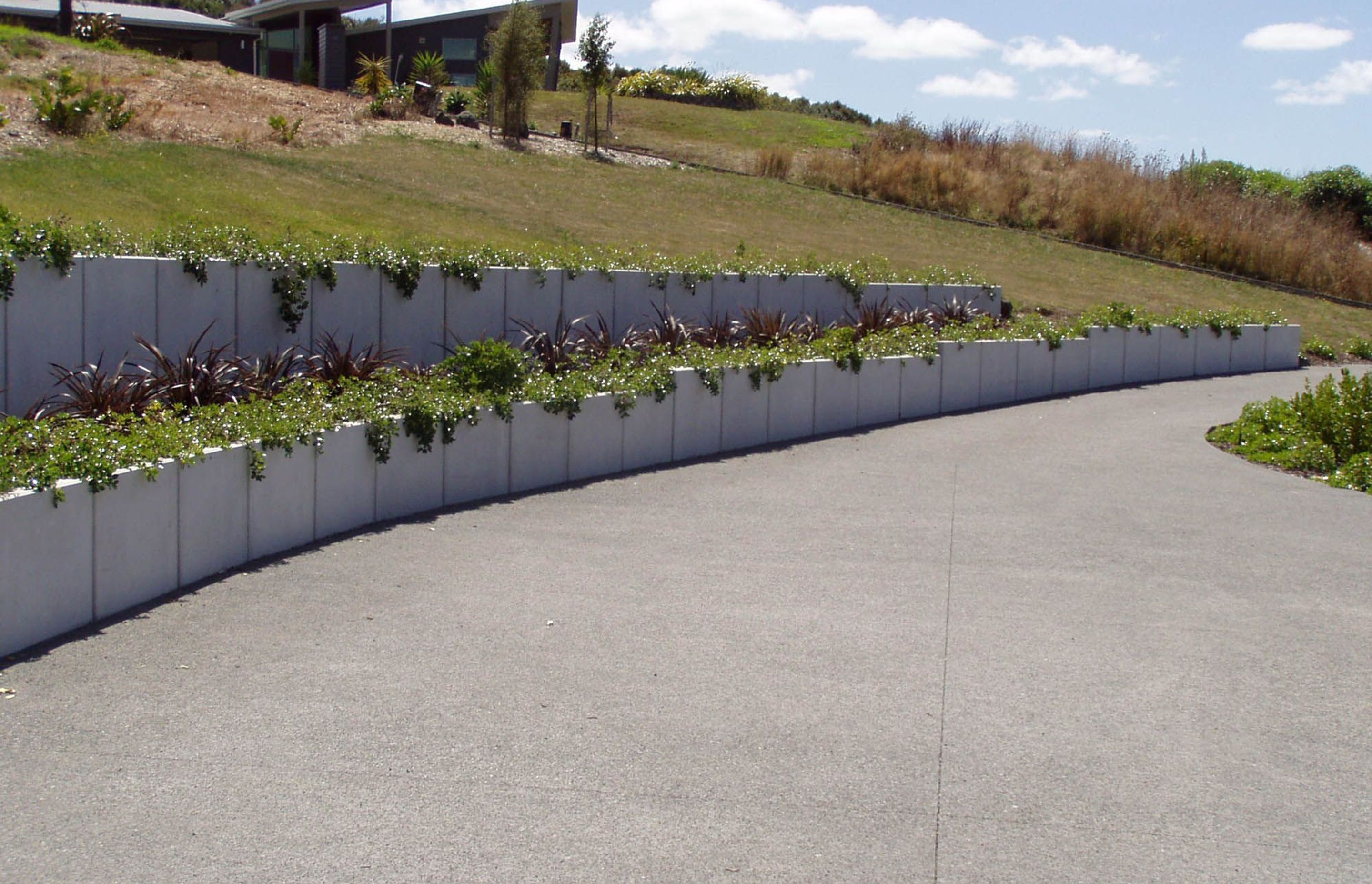 The Lusit Retaining Wall system is a precast concrete engineered wall suitable for a wide variety of ground retention uses.
