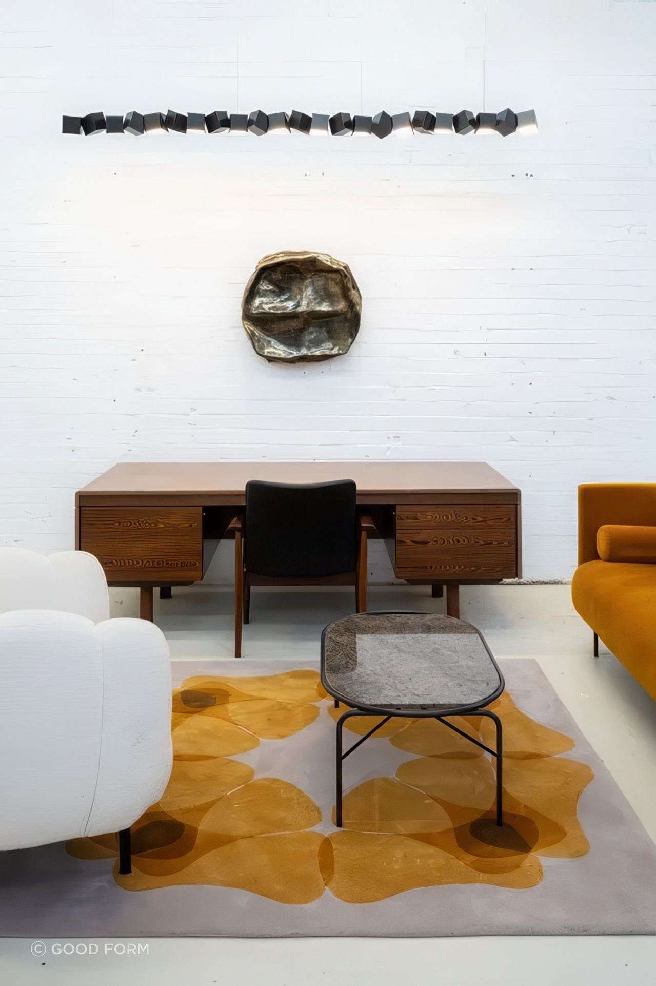 Warm Nordic lounge pieces featured with Quadriligia Rug by Chiara Corbeletto for Dilana, Blockchain Pendant from Oblure, vintage desk from Gordon Russell from Mr. Bigglesworthy and artwork by Monique Lacey from Foenander Galleries.