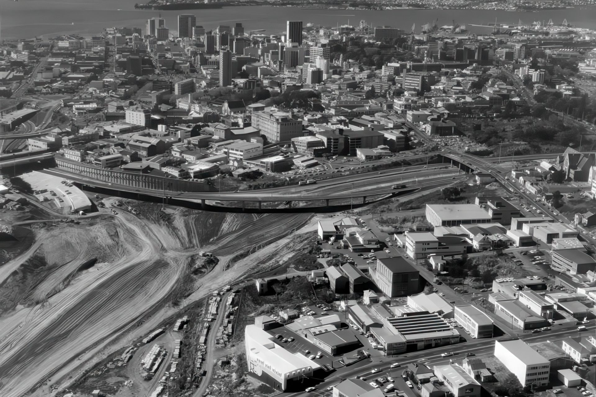 The original building and an aerial view of the epic saw tooth roof, photographed by Whites Aviation in 1978 during the development of Auckland's Spaghetti Junction.