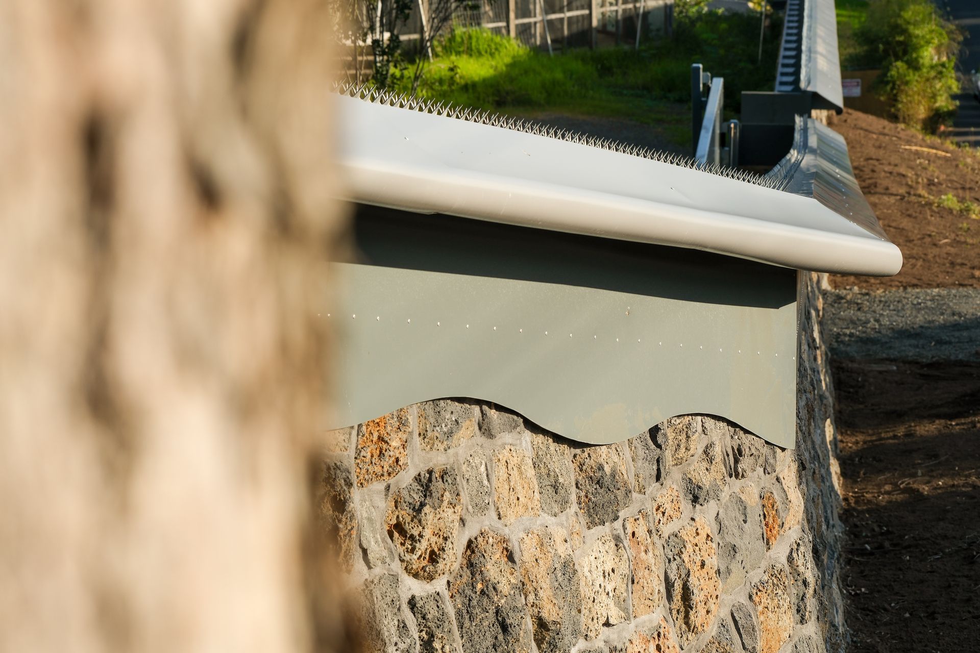 Unlike the old boundary wall, the work by Auckland Stonemasons has been built to last.