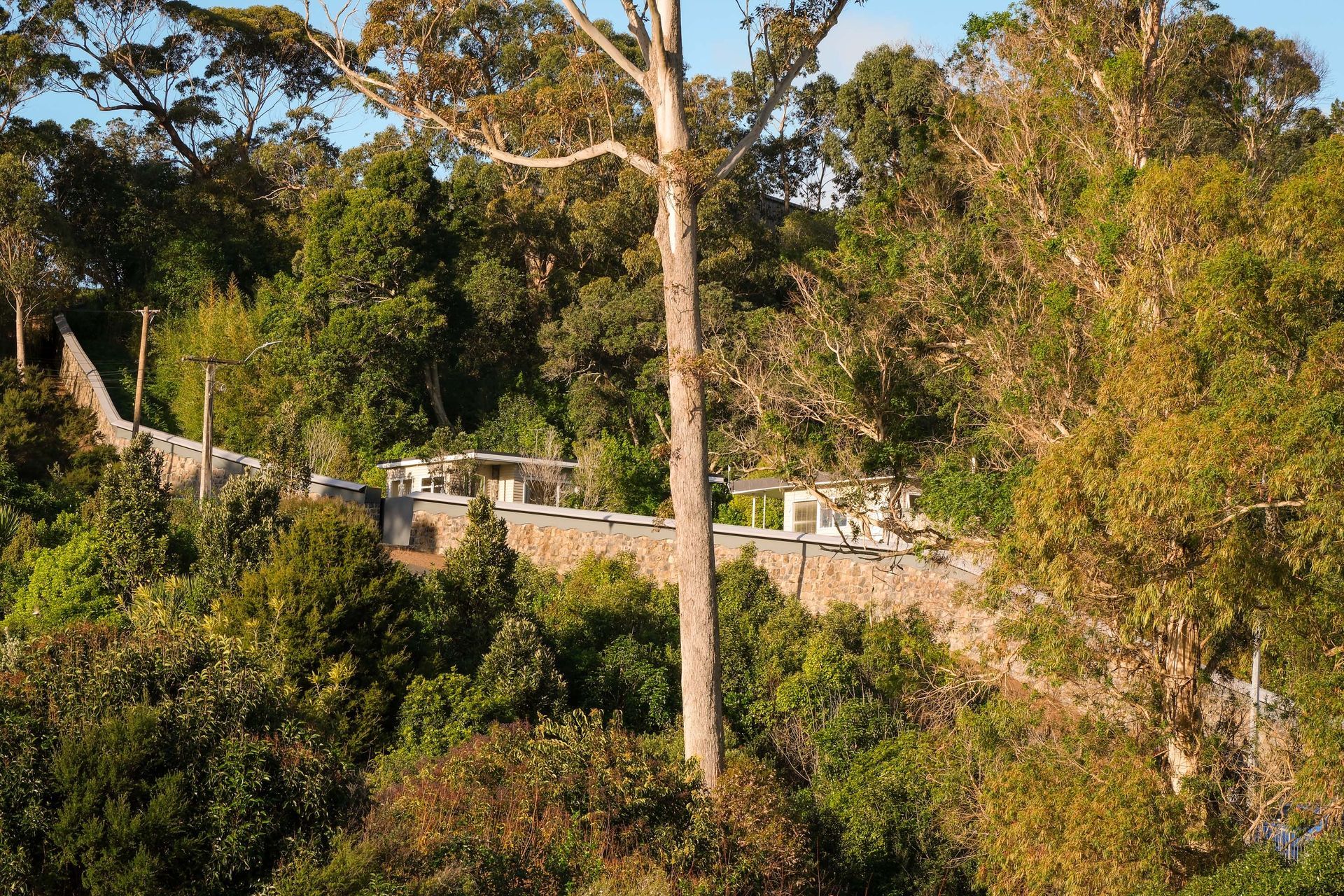 Although the zoo boundary wall didn't face the challenge of changing tides, the steep incline required careful planning and engineering.