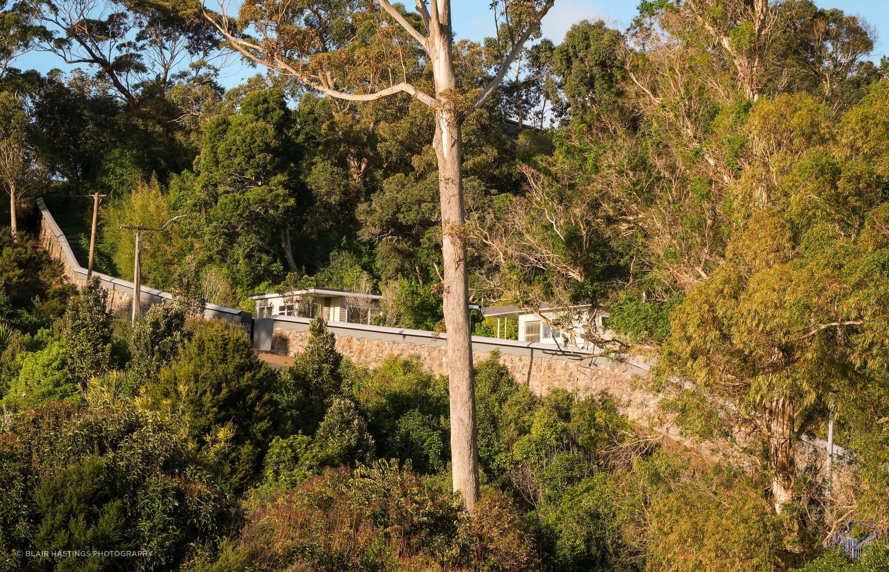 Although the zoo boundary wall didn't face the challenge of changing tides, the steep incline required careful planning and engineering.