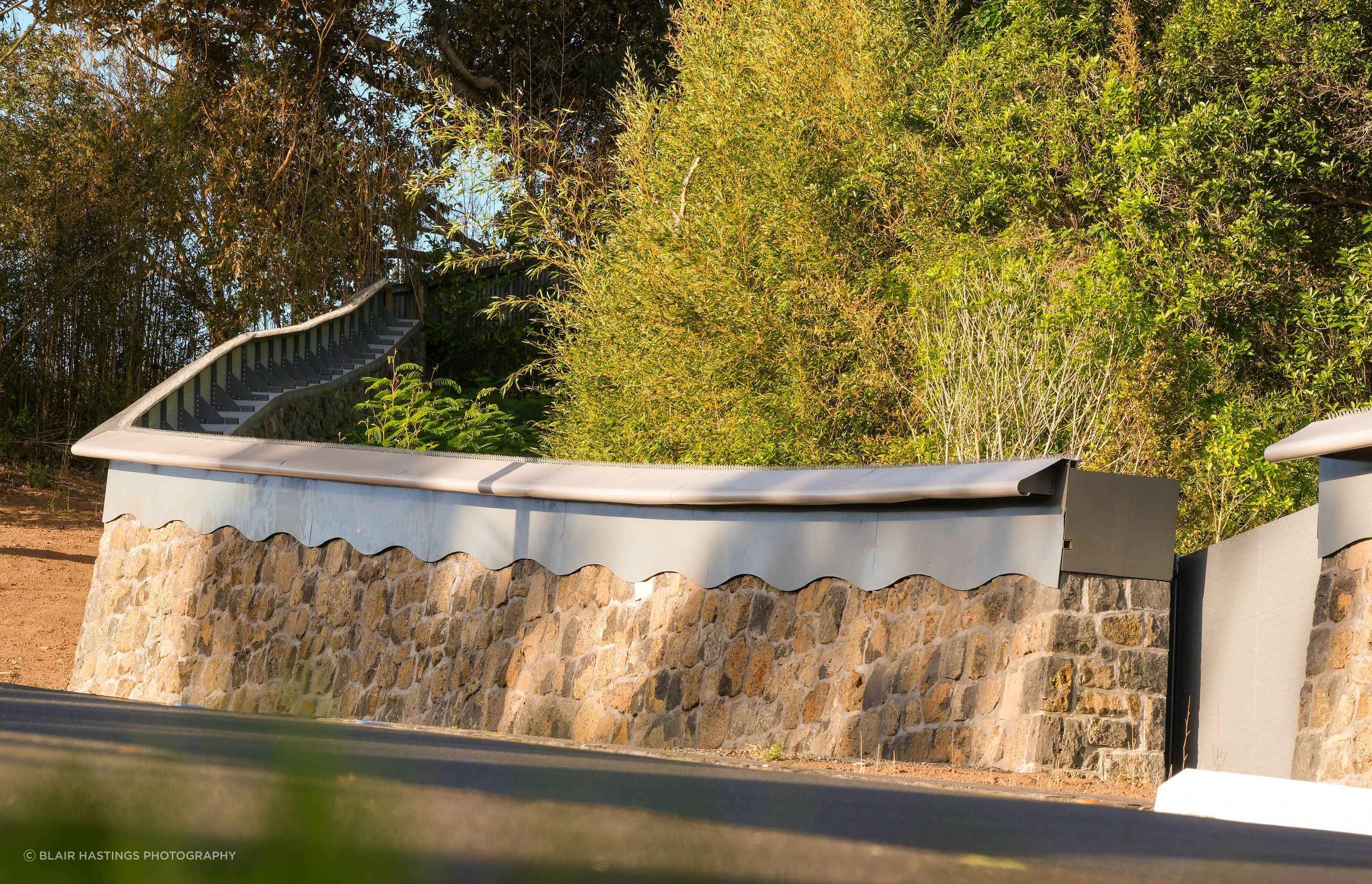 The stone wall and its detailing has been made to blend with the existing boundary wall and other older stone structures within the zoo.