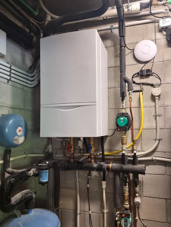 An existing gas boiler for underfloor, spa, and potable water heating.