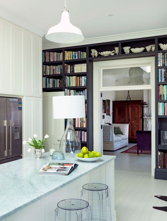 Dark cabinetry makes a statement against the white surrounds.