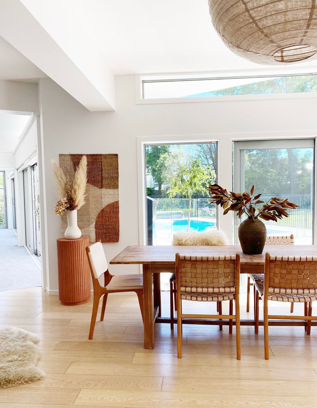 The dining table from Hawthorn Collections pairs with leather chairs in the dining area.