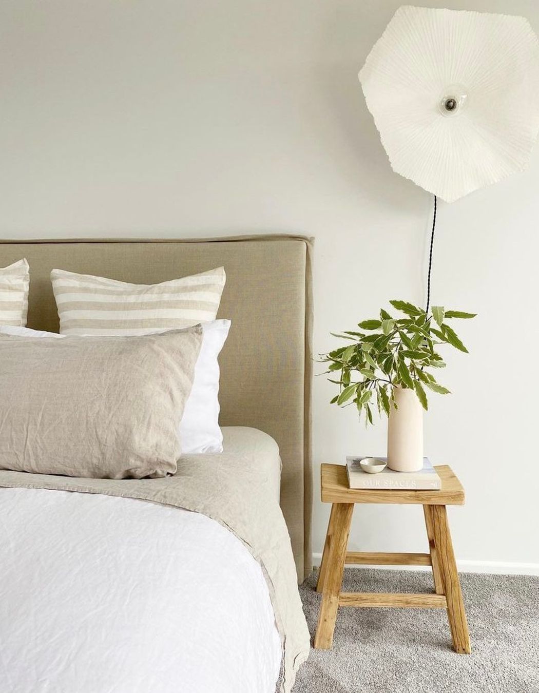 Natural fibres and colours create a calming environment in the bedroom.