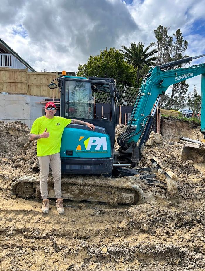Max pictured on the job with his business KPA Plumbing.