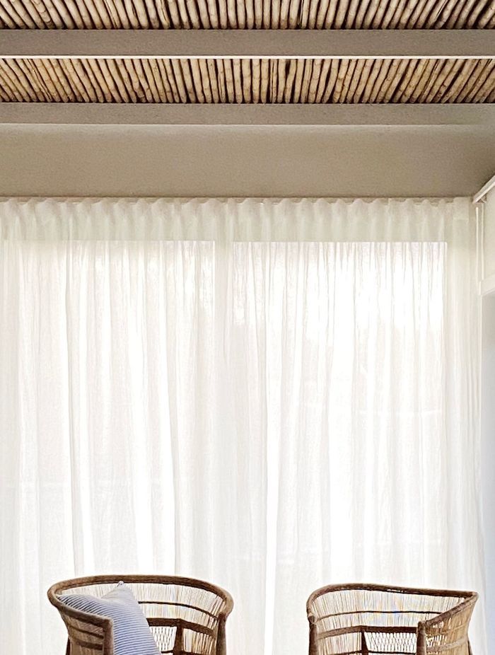 The bamboo ceiling extends from interior to exterior.