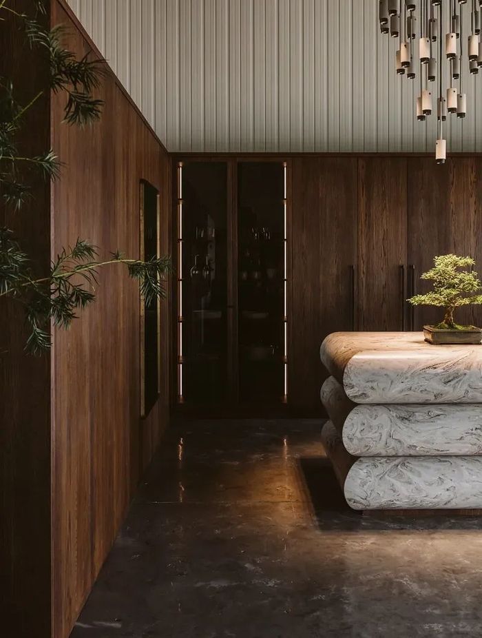Oak veneer cabinetry boldly features in this award-winning brutalist-style kitchen. | Photography: Gina Fabish