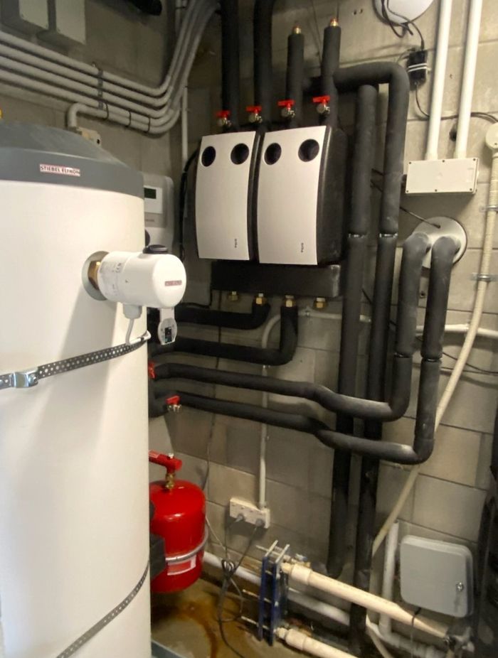 The new plant room set-up replacing the gas boiler with a heating circuit pump station and potable water cylinder.
